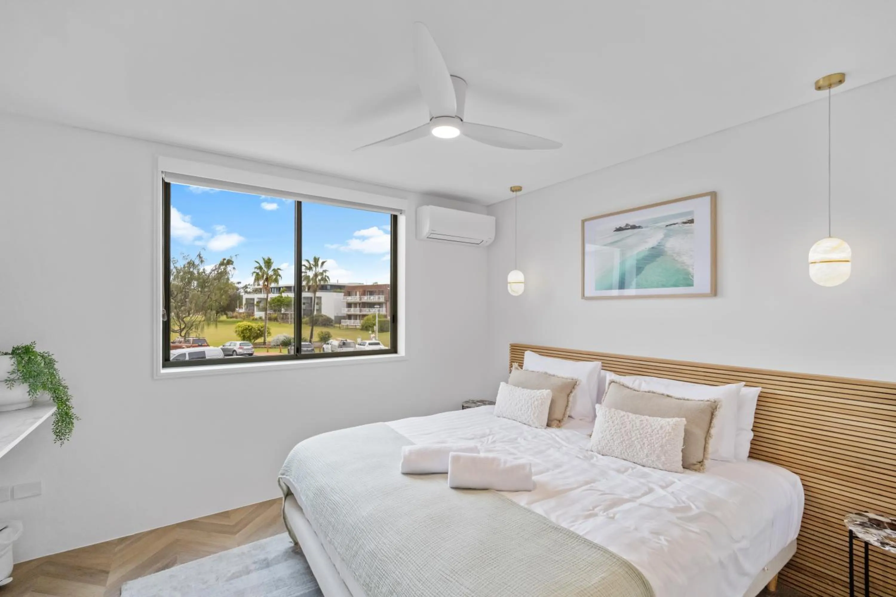 Bed in Bay Royal Apartments