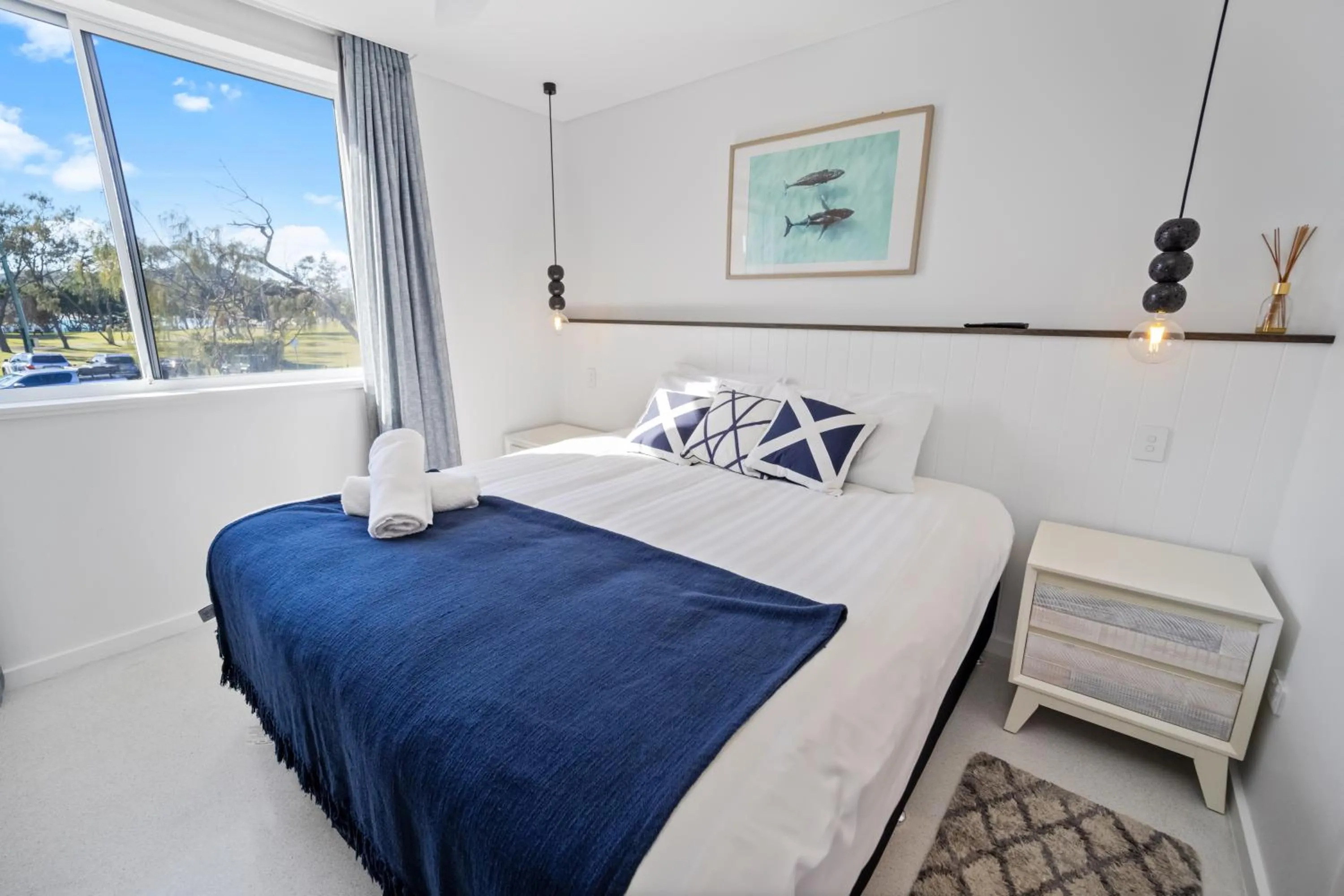 Bed in Bay Royal Apartments