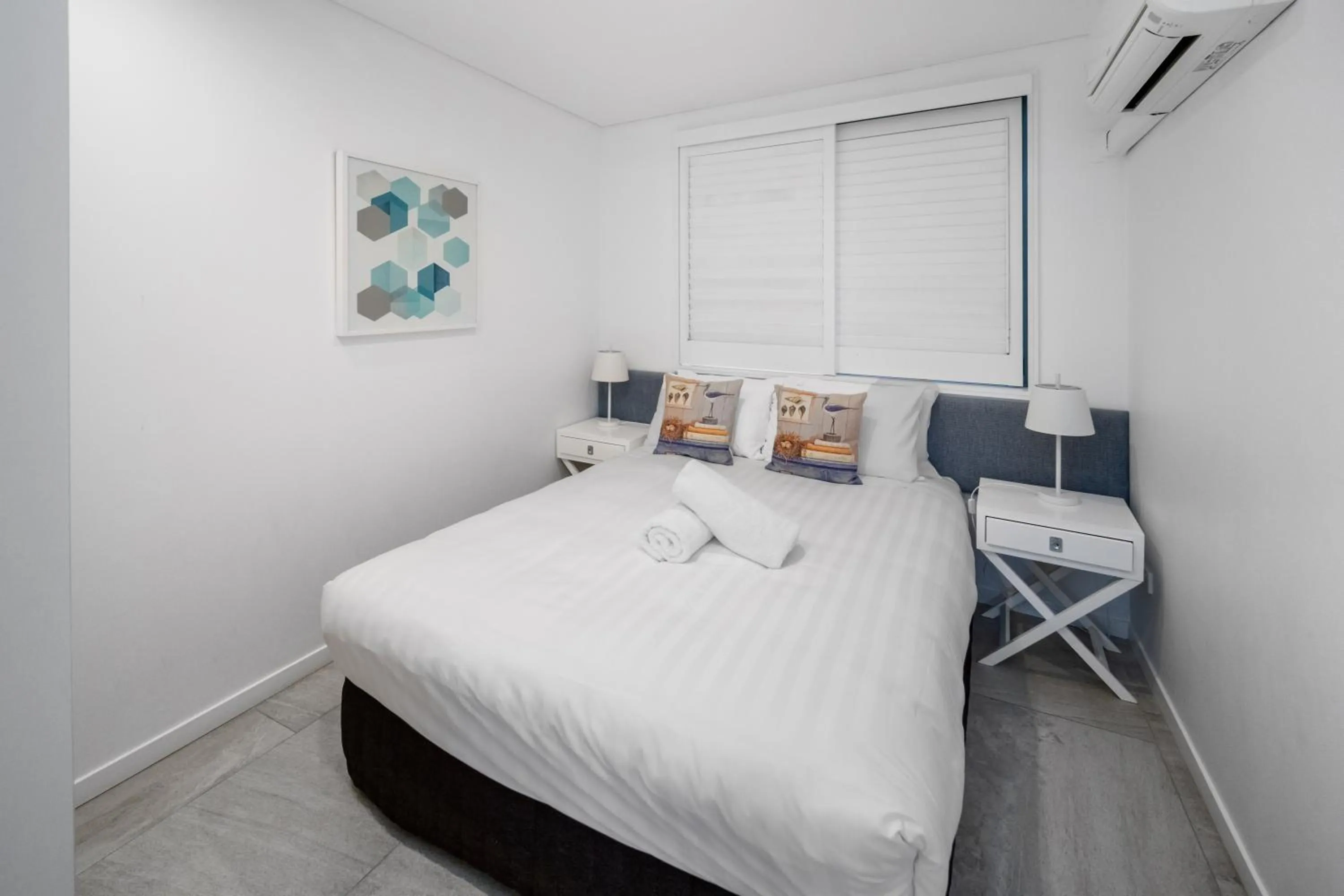 Bed in Bay Royal Apartments