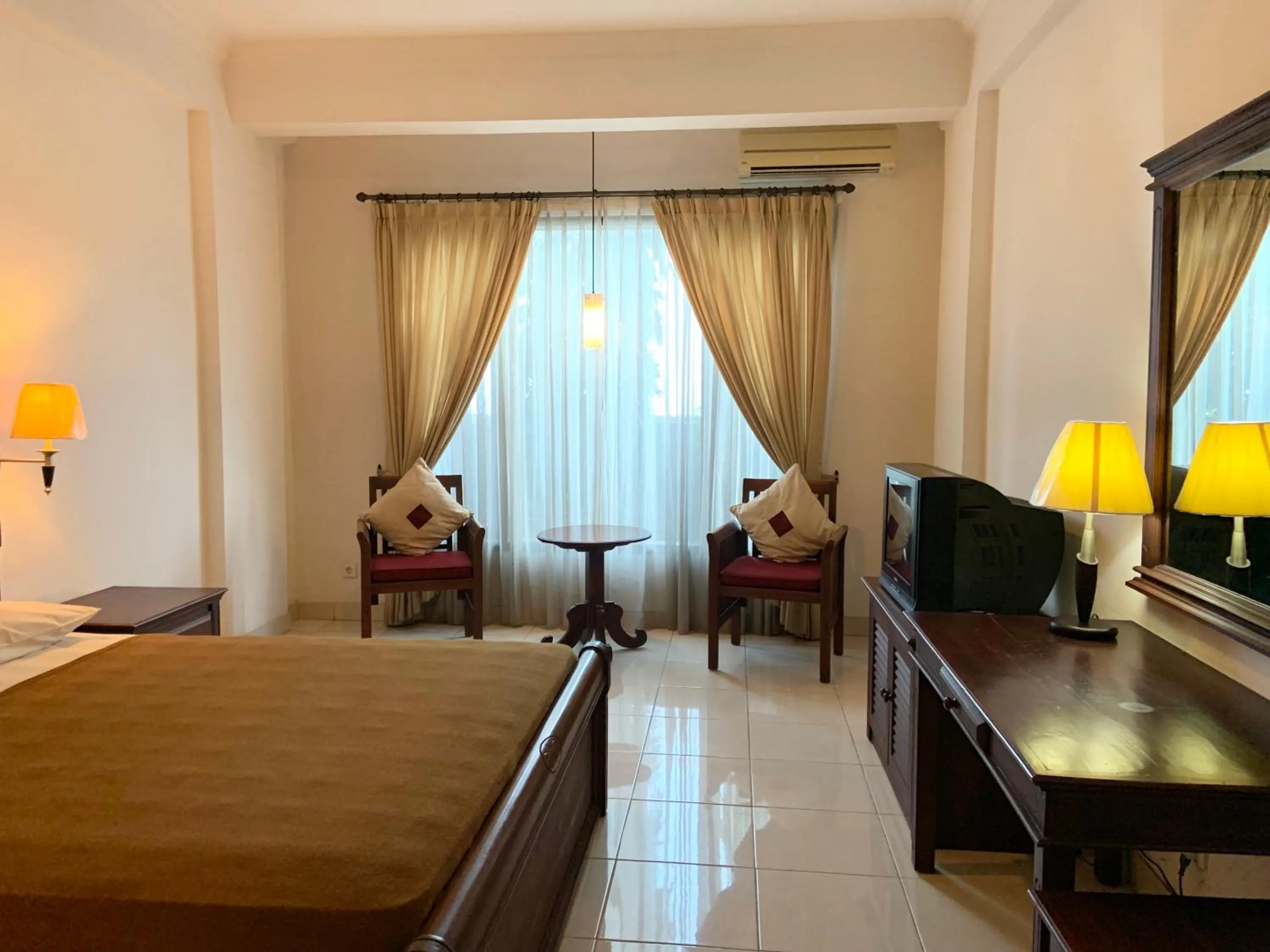 Photo of the whole room, Bed in Nirwana Suites