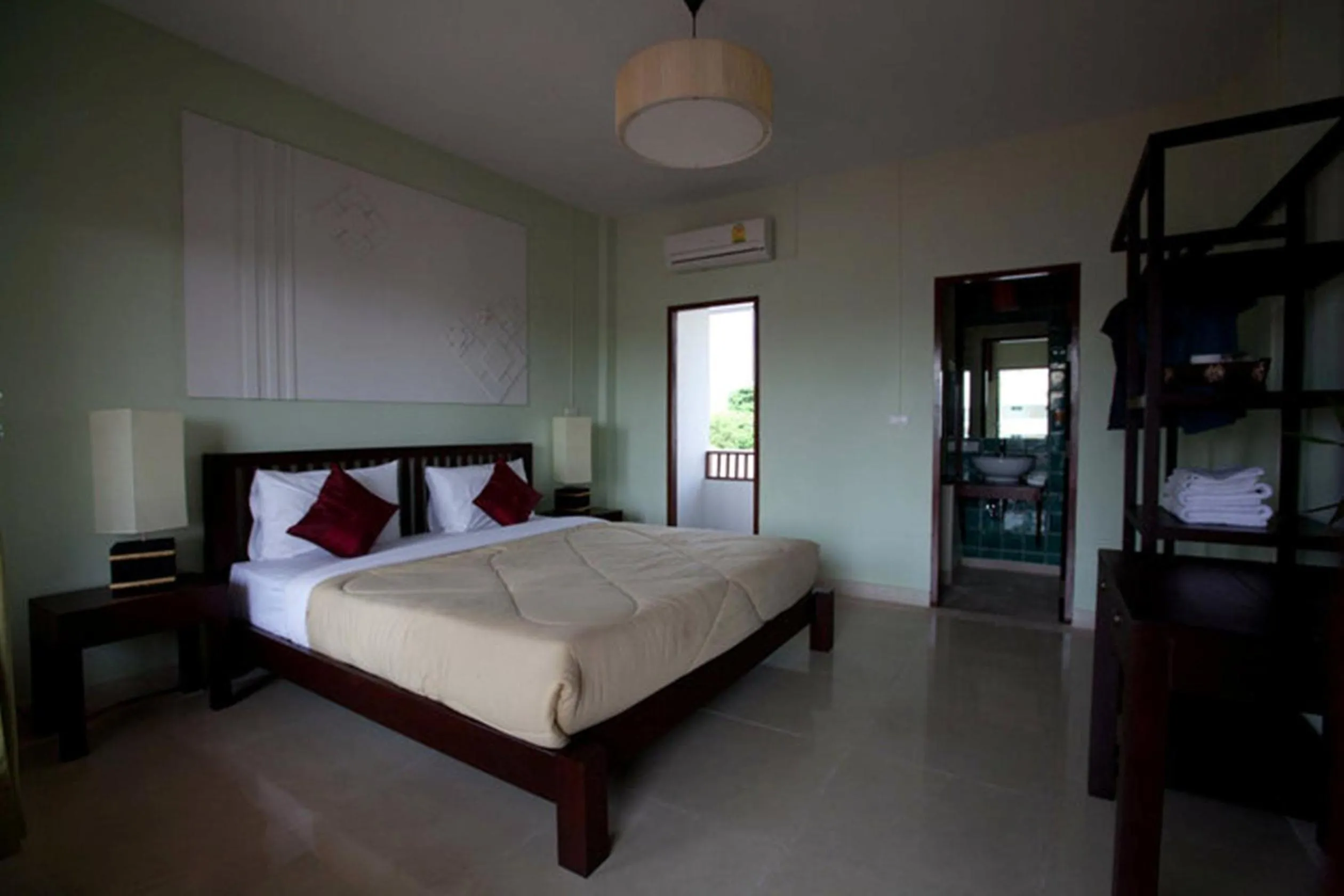 Bed in Yindee Stylish Guesthouse