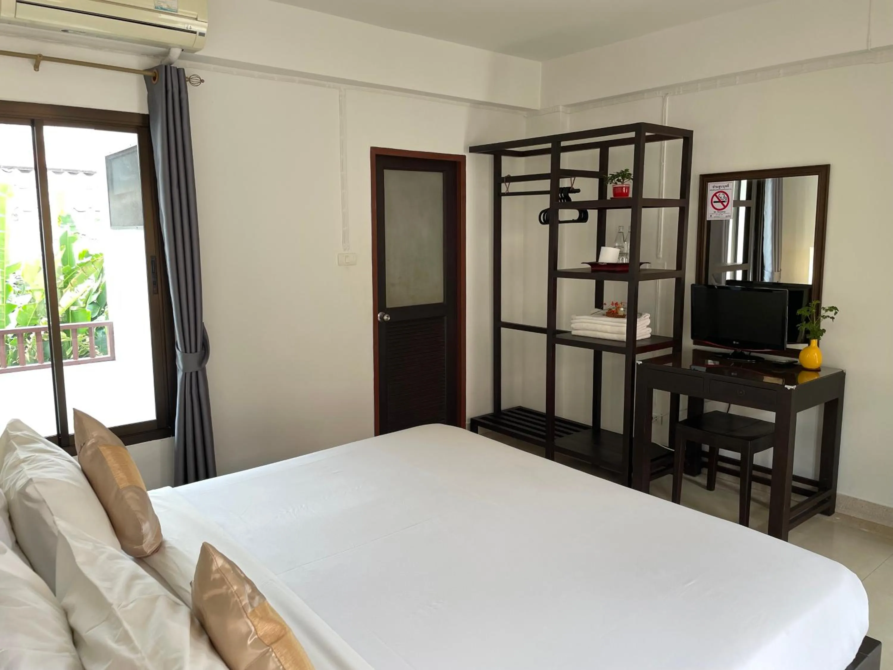 Bed in Yindee Stylish Guesthouse