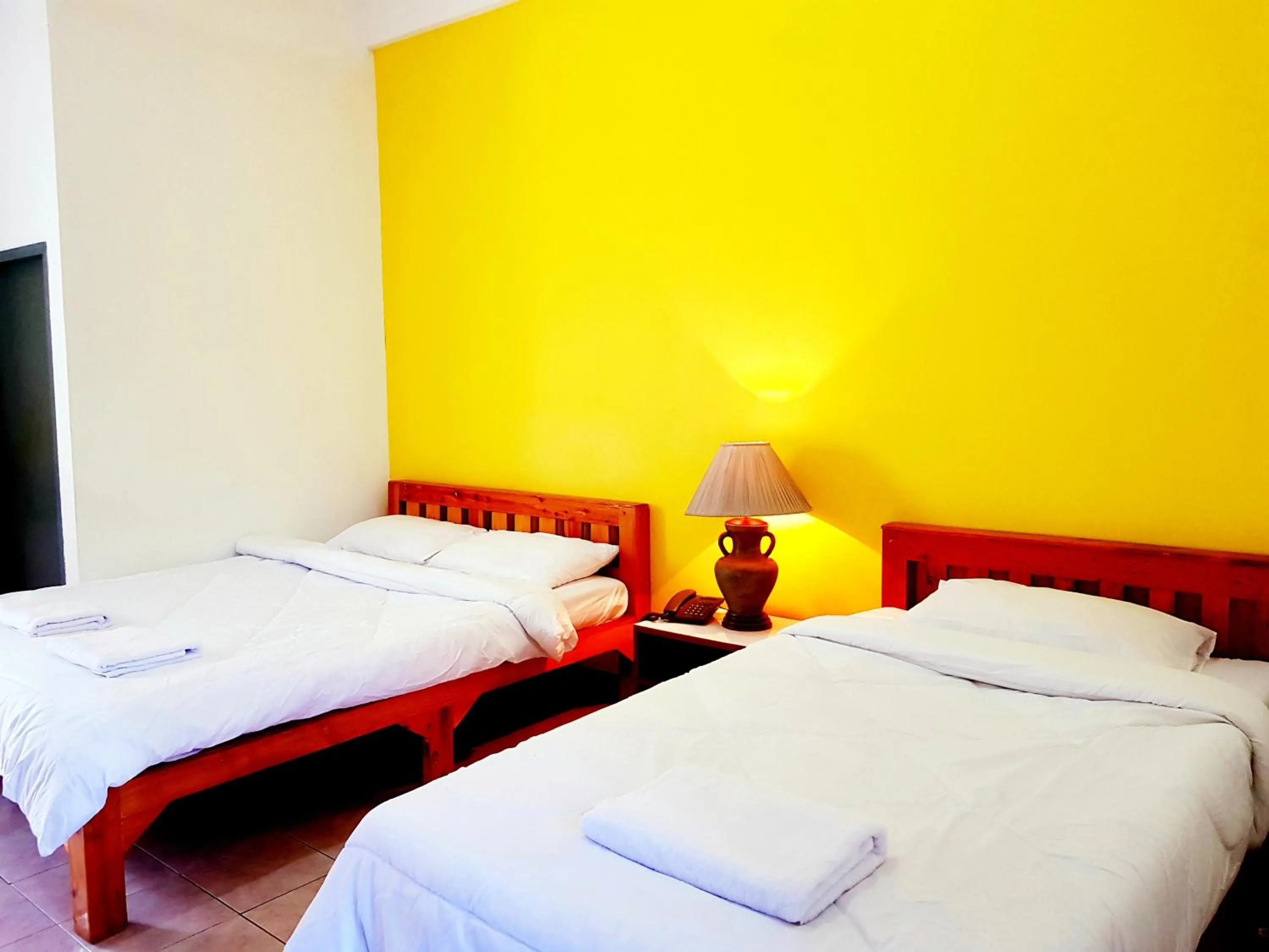 Bed in Wiang Inn Mansion