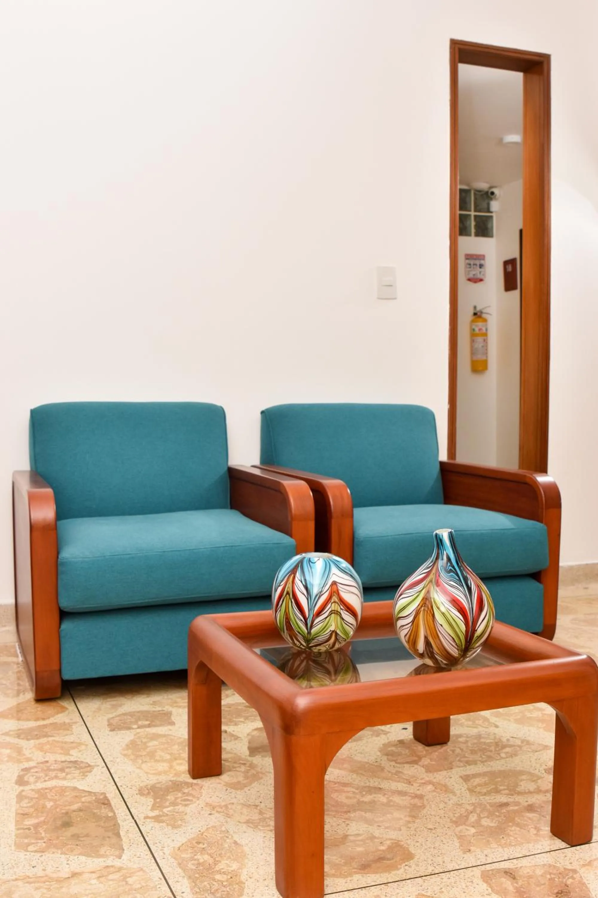 Communal lounge/ TV room in La Campana Hotel Boutique