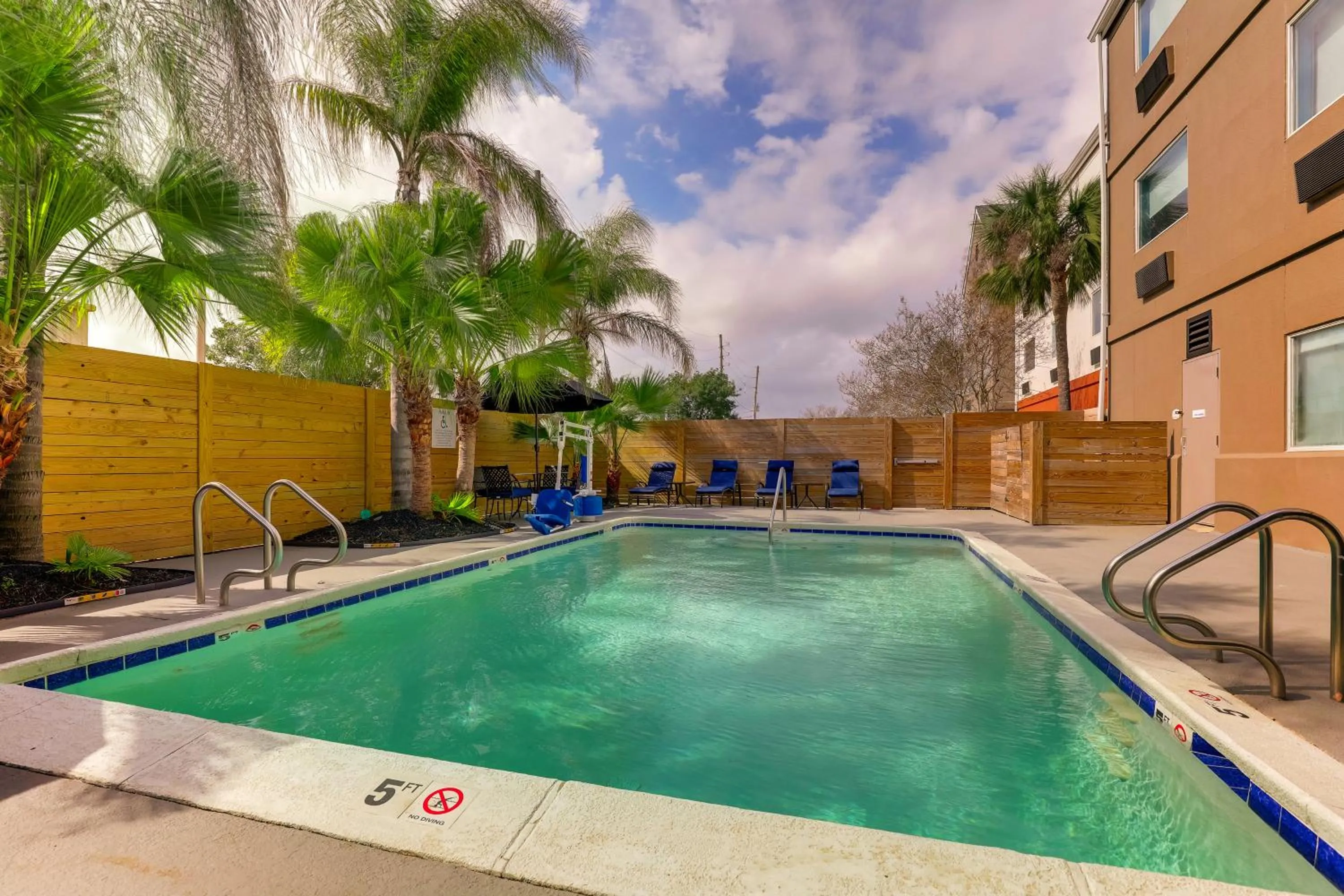 Pool view in Holiday Inn Express Kenner - New Orleans Airport by IHG
