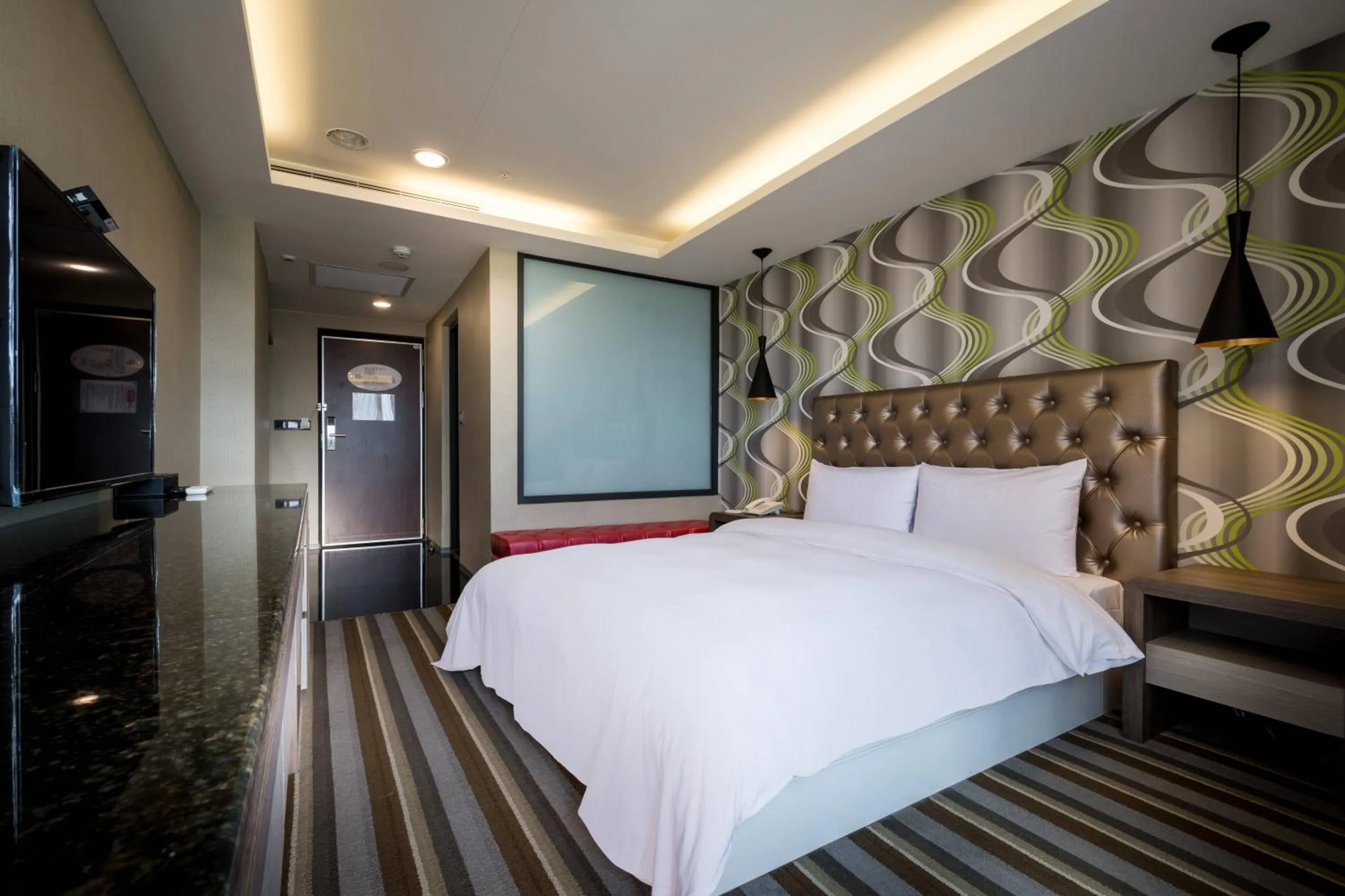 Bed in JUNG-ZAW BUSSINESS HOTEL