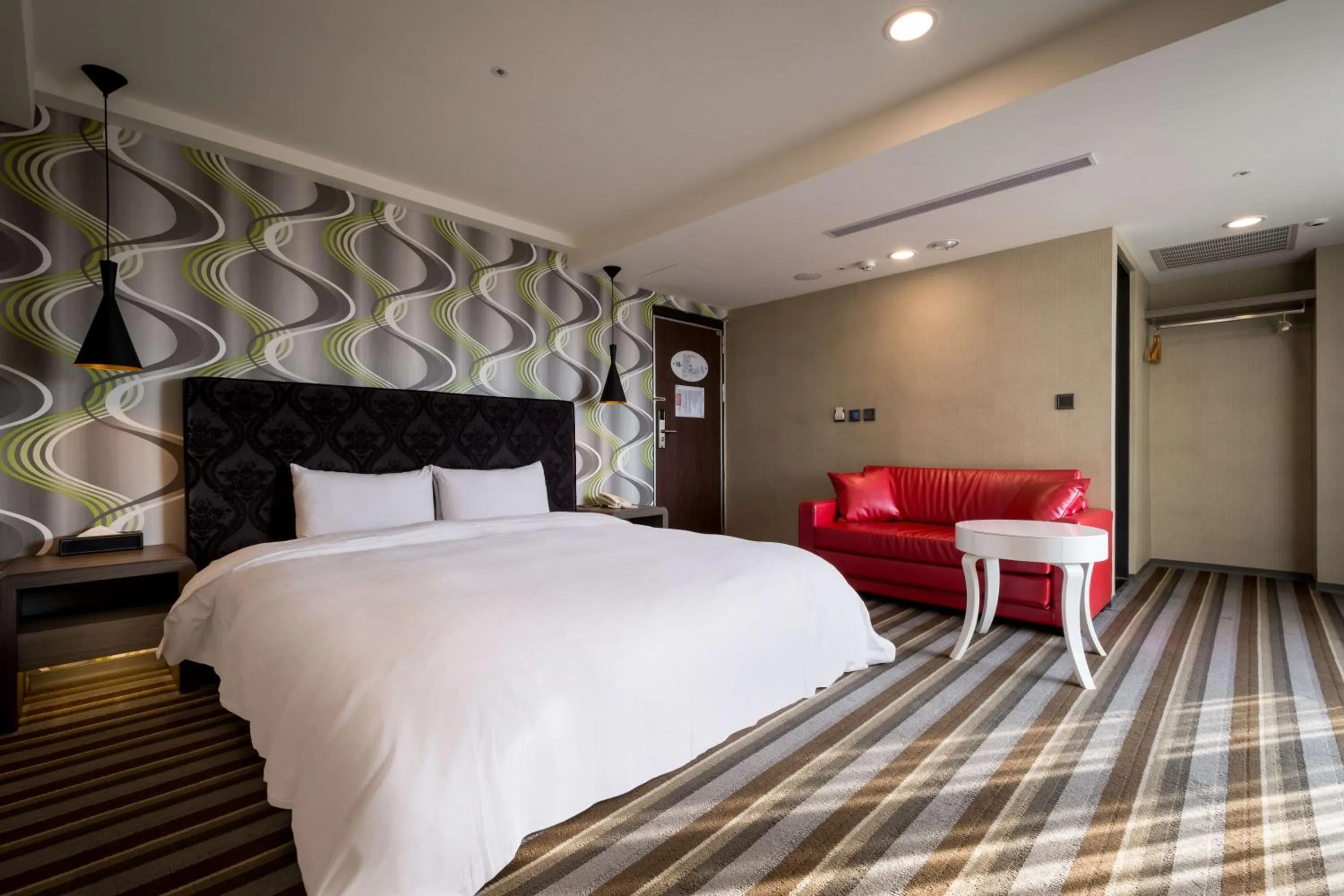 Bed in JUNG-ZAW BUSSINESS HOTEL