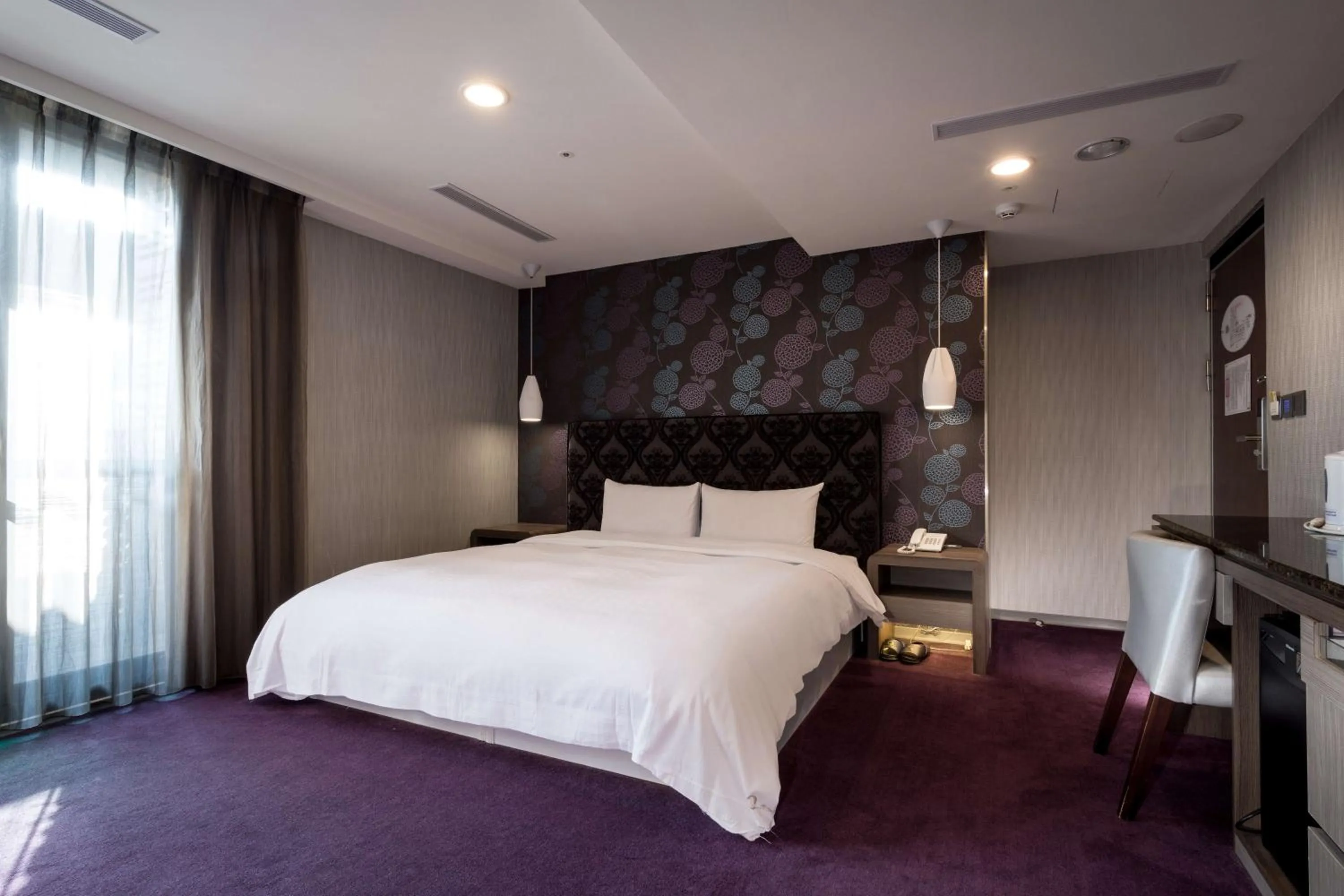 Bed in JUNG-ZAW BUSSINESS HOTEL