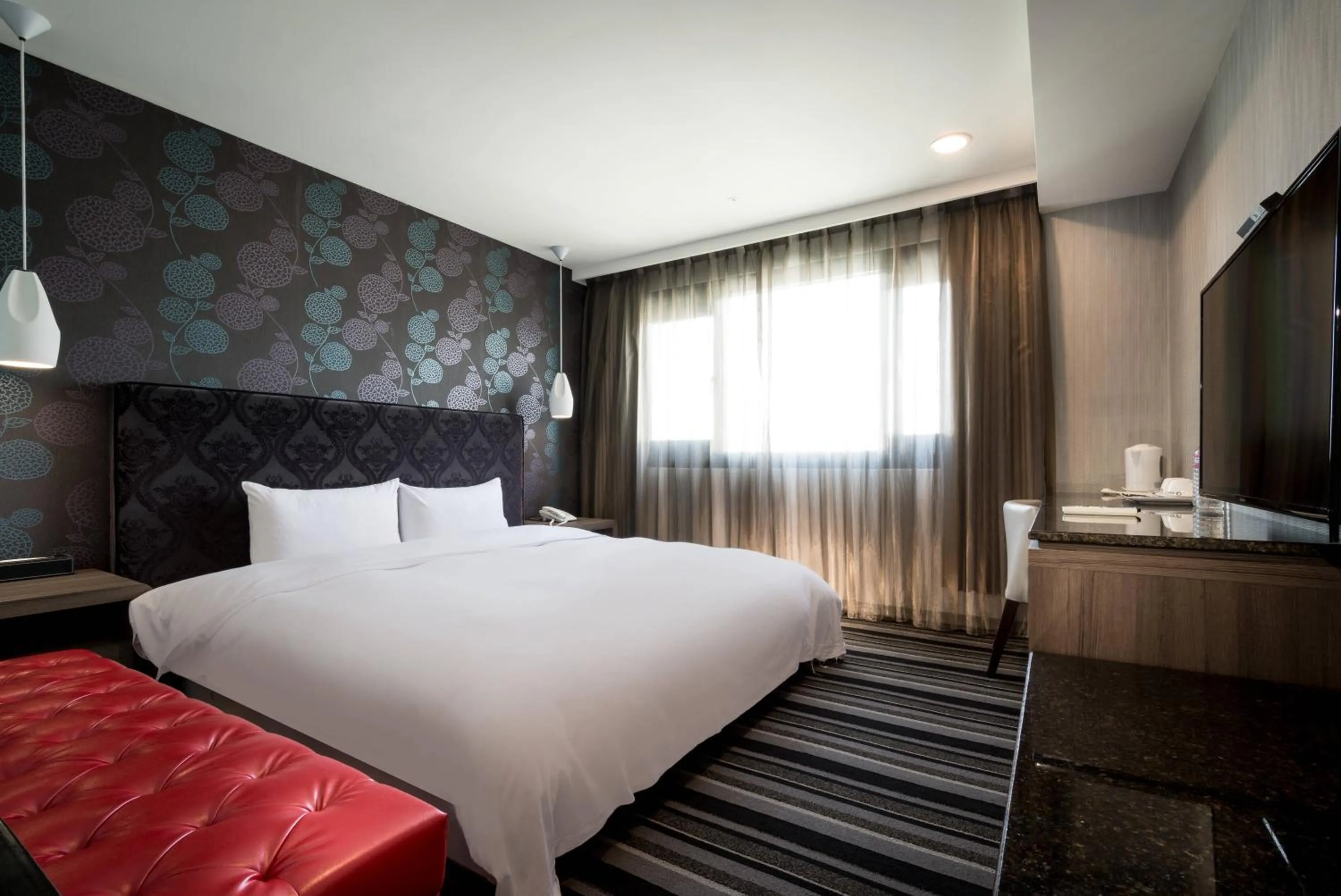 Bed in JUNG-ZAW BUSSINESS HOTEL