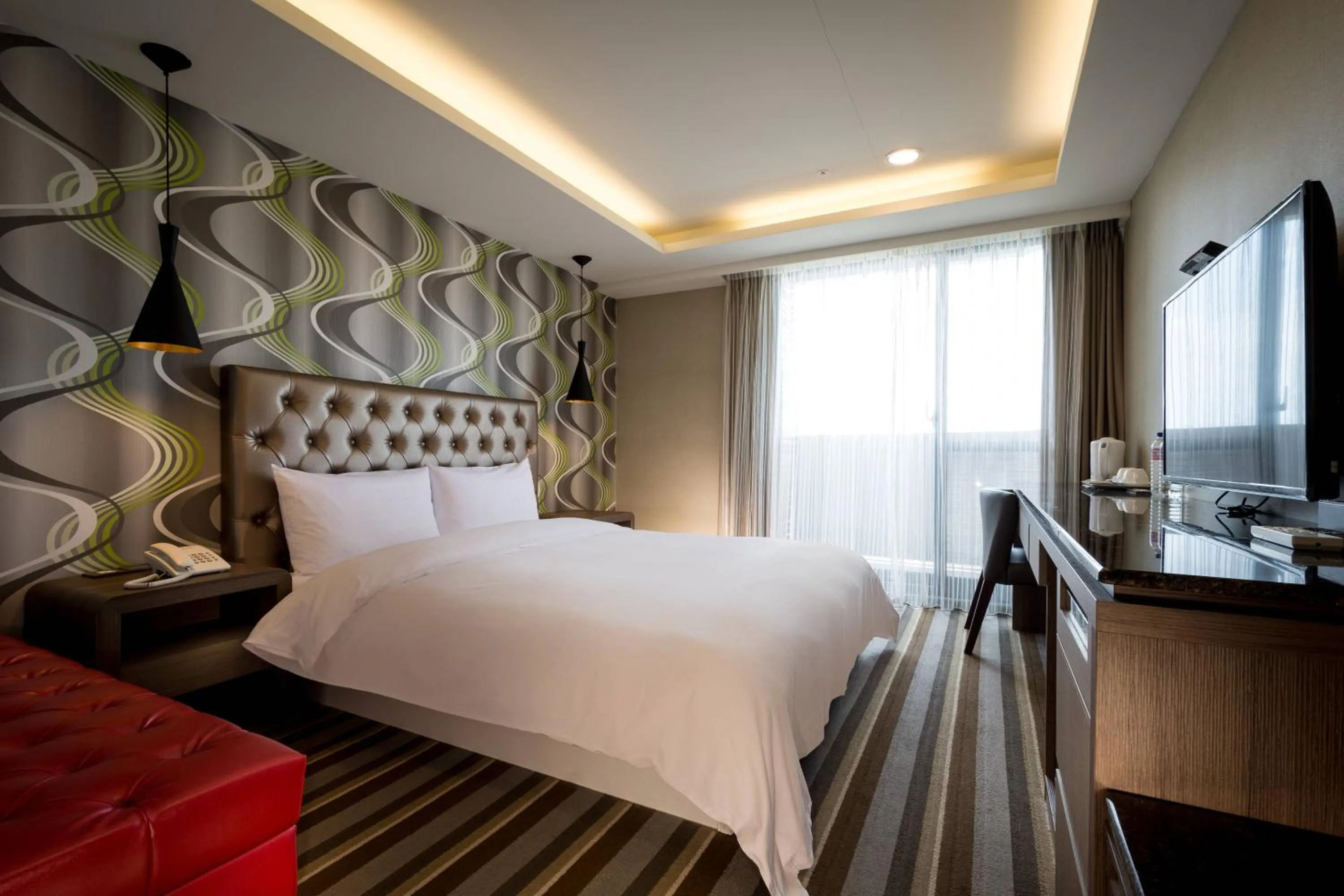 Bed in JUNG-ZAW BUSSINESS HOTEL