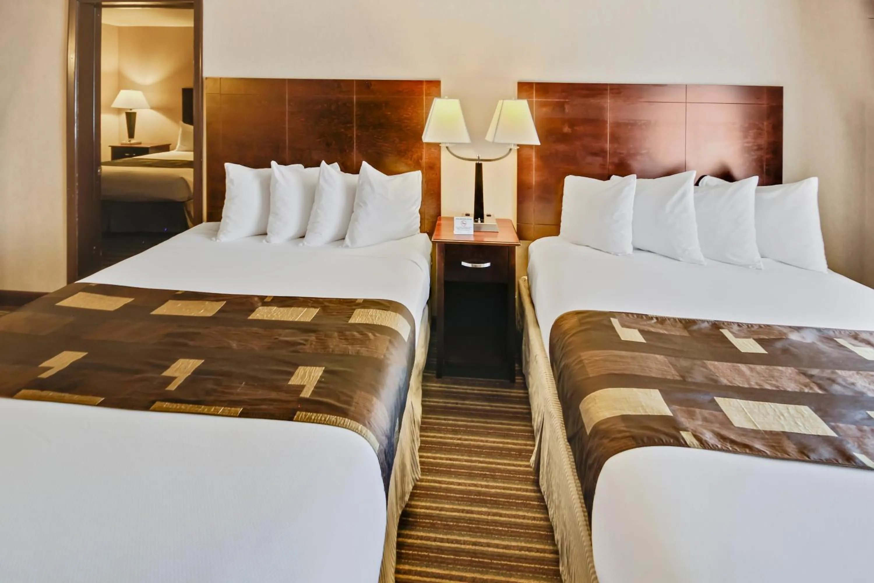 Bed in Yellowstone West Gate Hotel