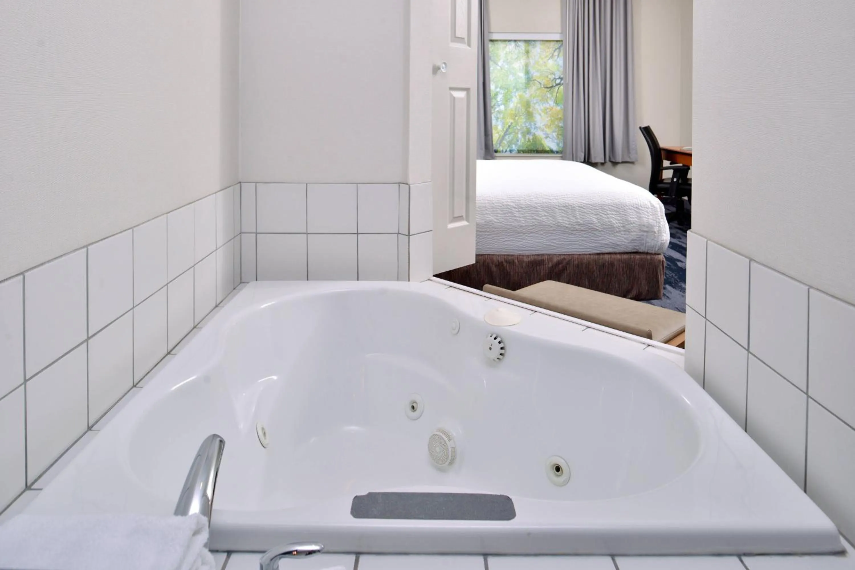 Swimming pool, Bed in Fairfield Inn and Suites Beloit