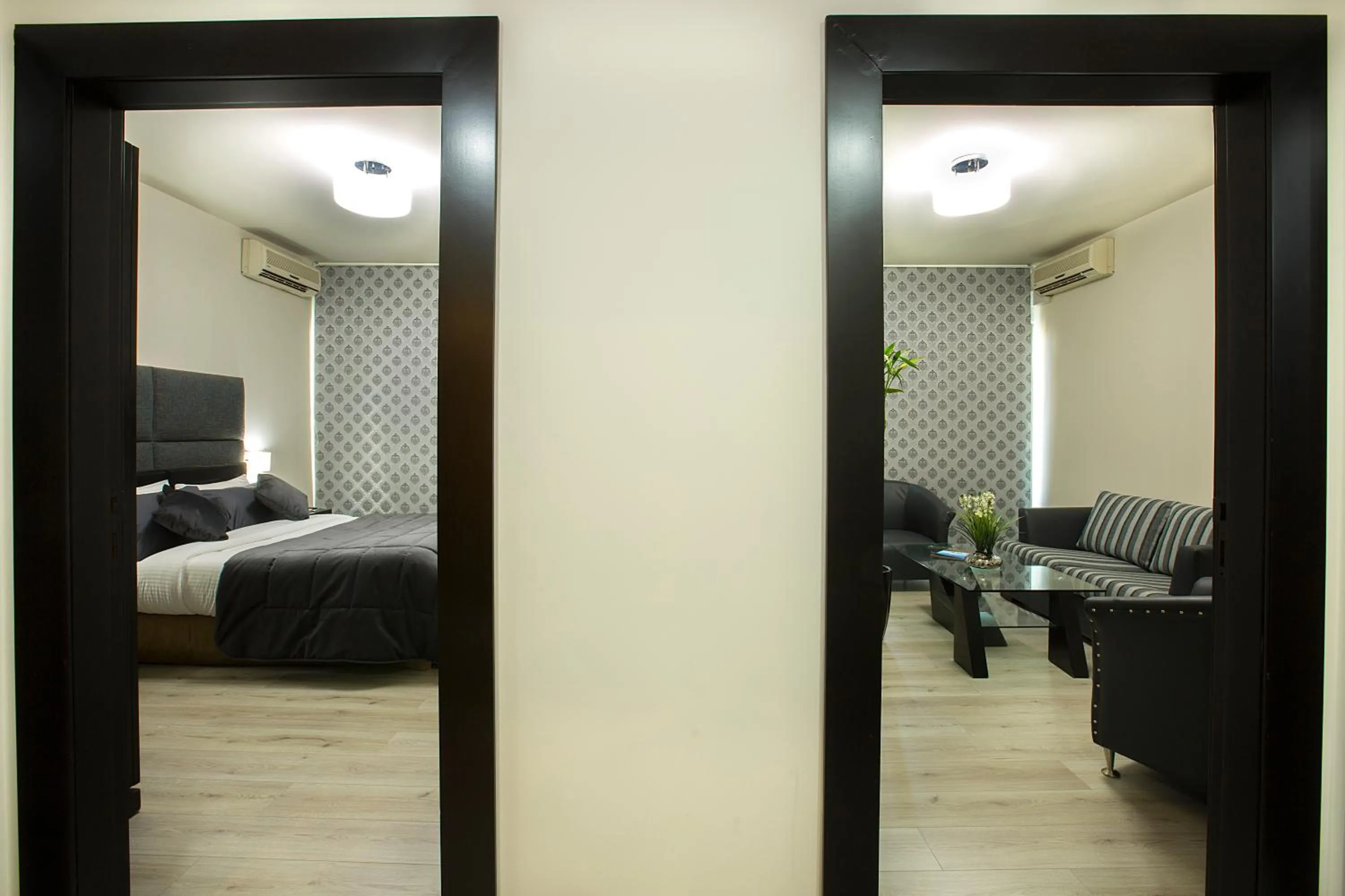 Living room, Bed in Orient Queen Homes Hotel