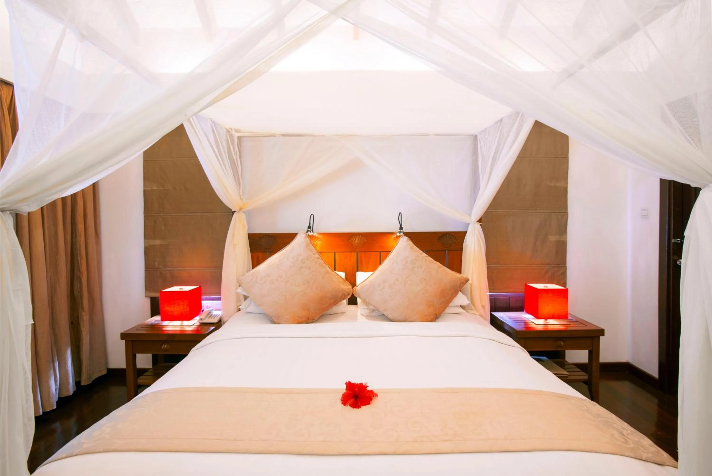 Bed in Medhufushi Island Resort