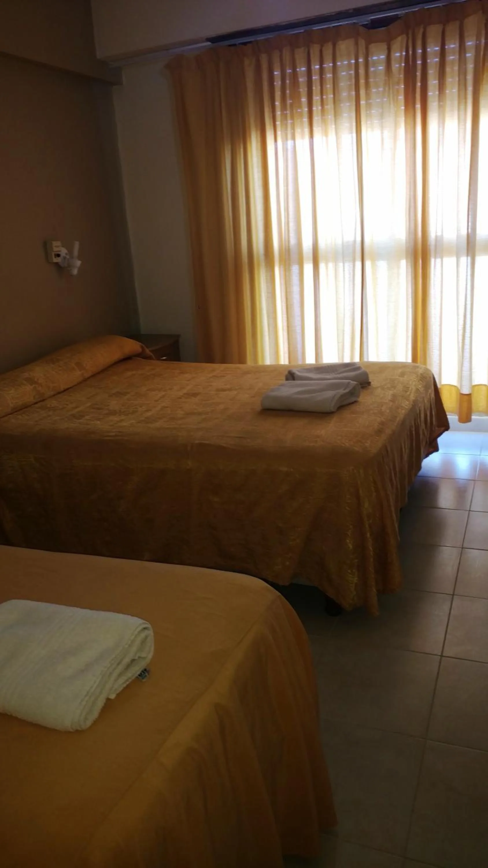 Bed in San Remo World Hotel