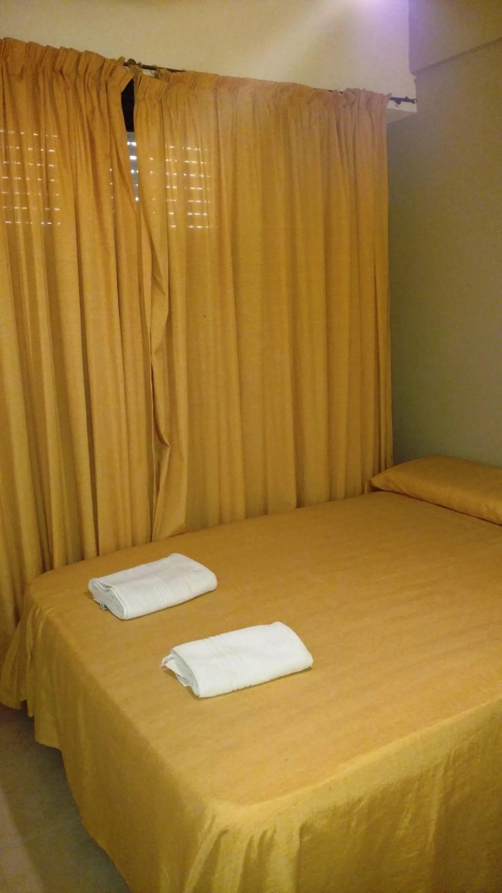 Bed in San Remo World Hotel