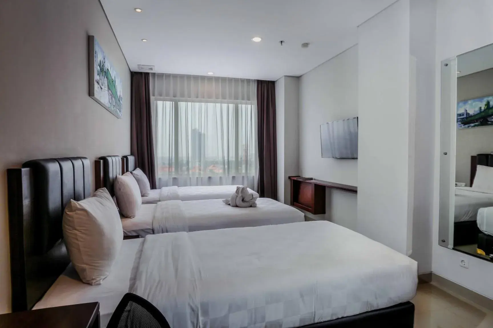 Superior Triple Room in PrimeBiz Hotel Surabaya Superior Triple Room in PrimeBiz Hotel Surabaya