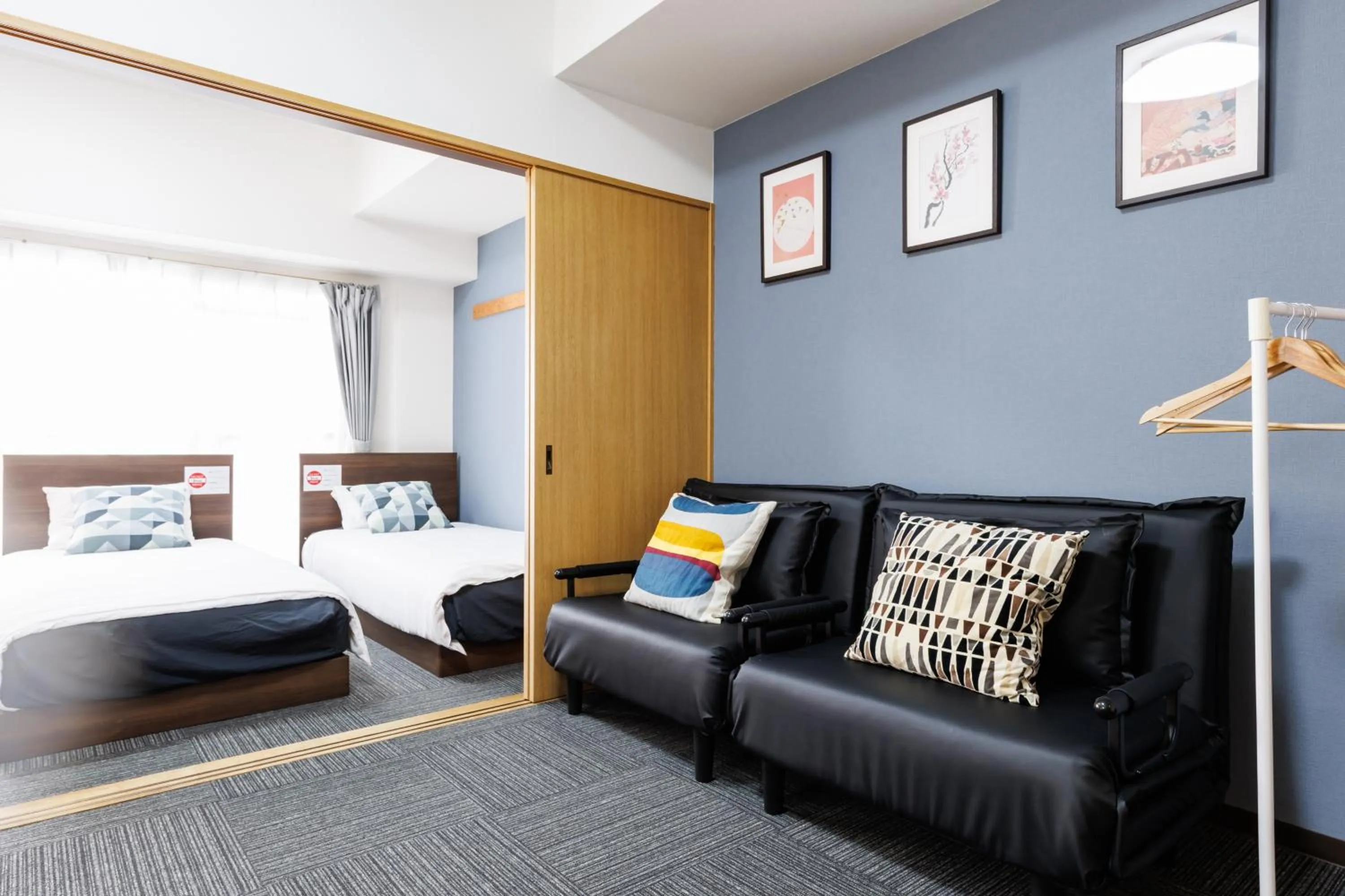 Bed in Grande Famille Shimanouchi Dotonbori Condo