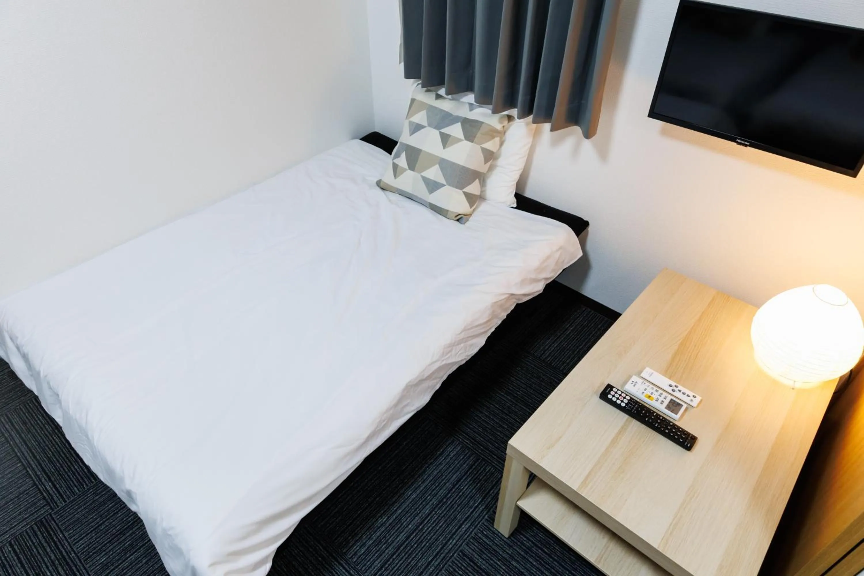 Bed in Grande Famille Shimanouchi Dotonbori Condo