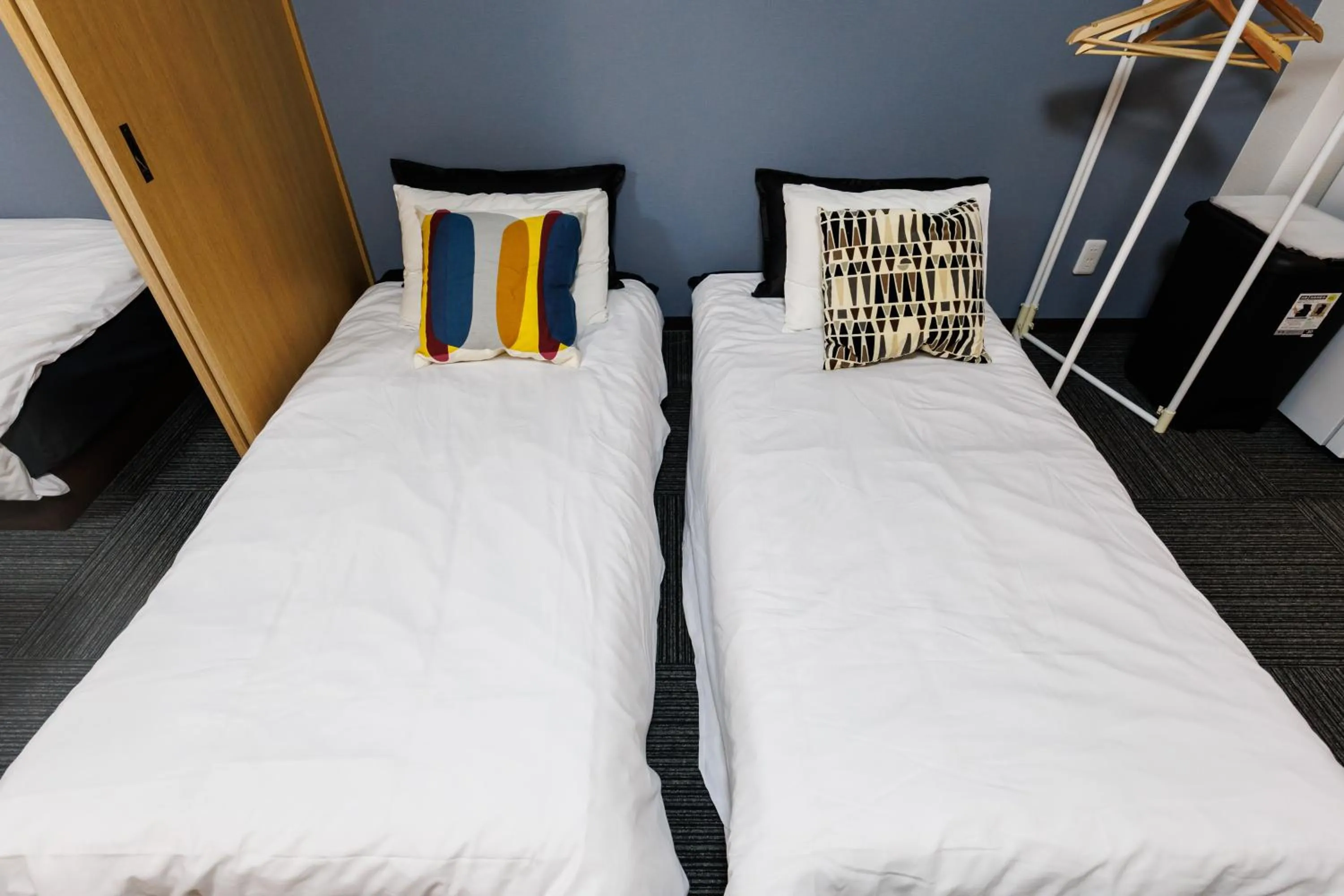 Bed in Grande Famille Shimanouchi Dotonbori Condo