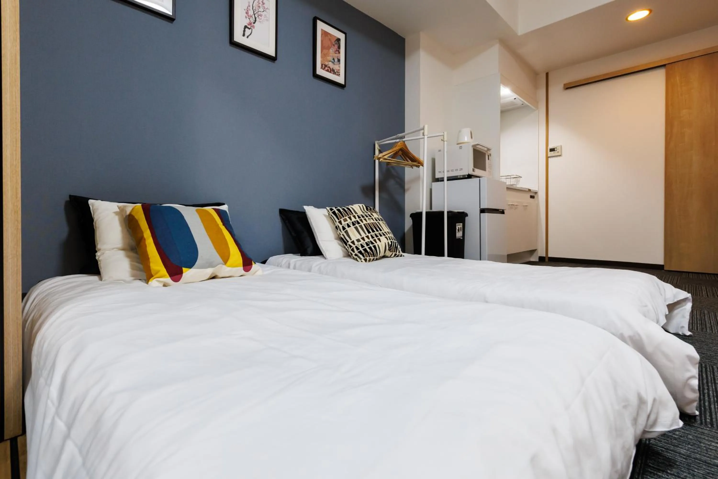 Bed in Grande Famille Shimanouchi Dotonbori Condo