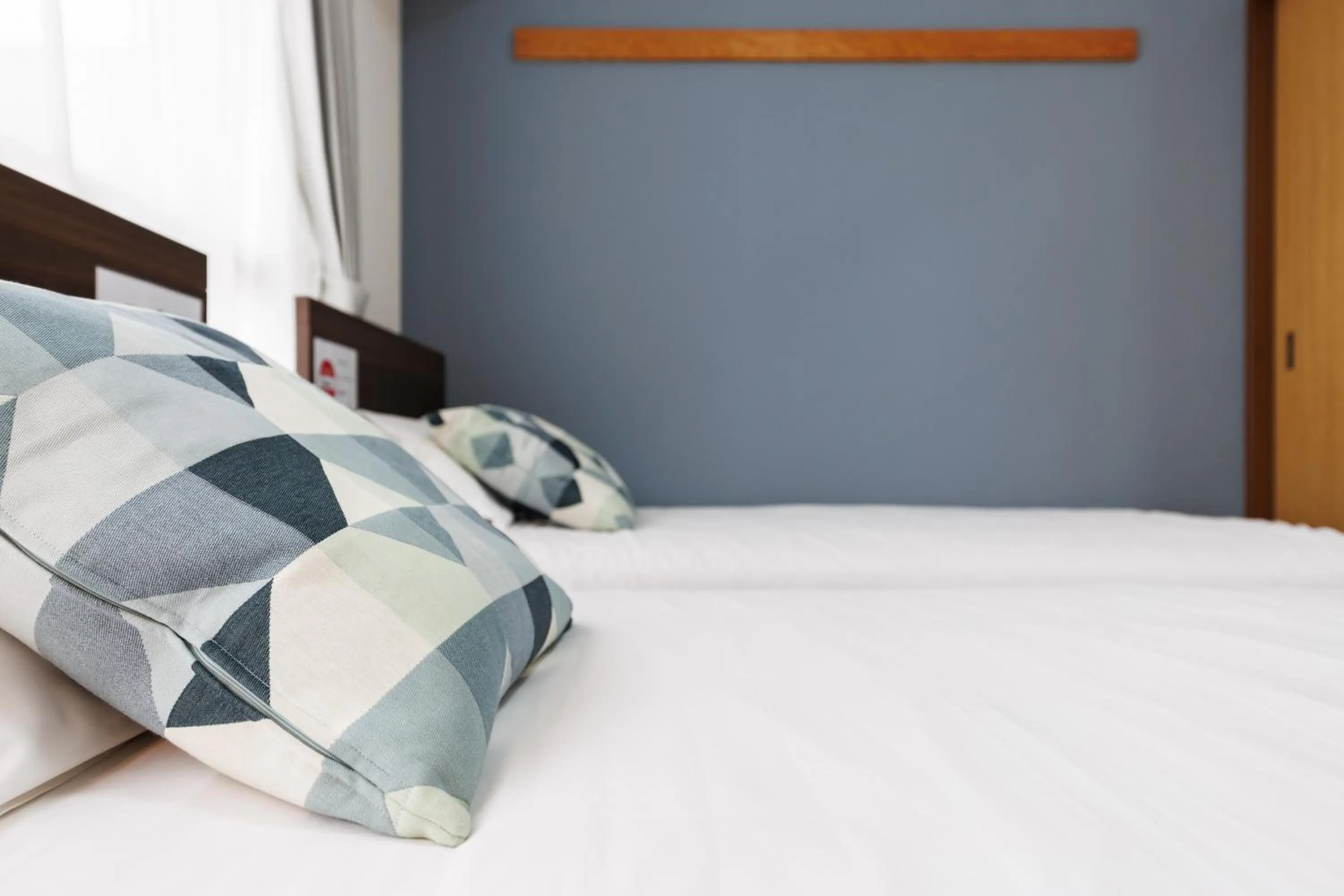 Bed in Grande Famille Shimanouchi Dotonbori Condo