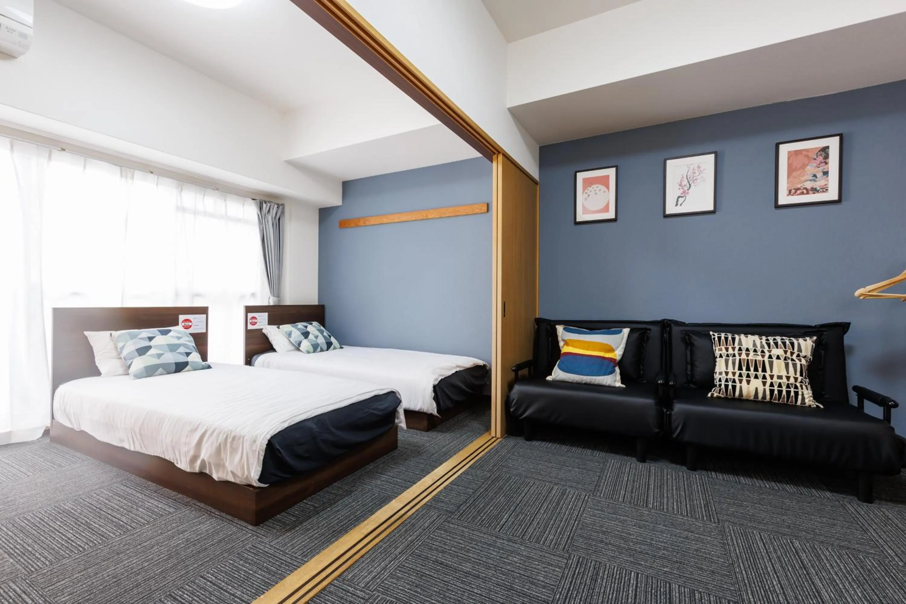 Bed in Grande Famille Shimanouchi Dotonbori Condo