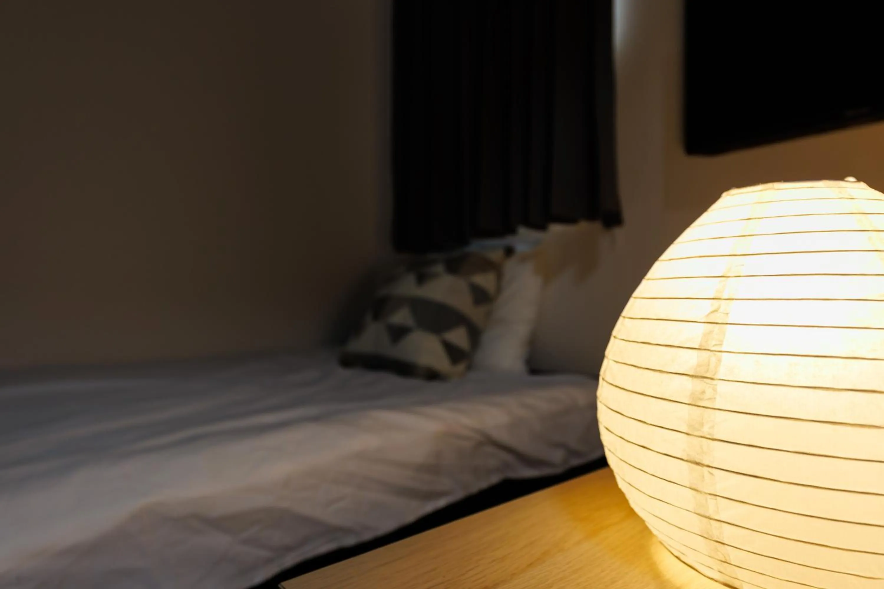 Bed in Grande Famille Shimanouchi Dotonbori Condo