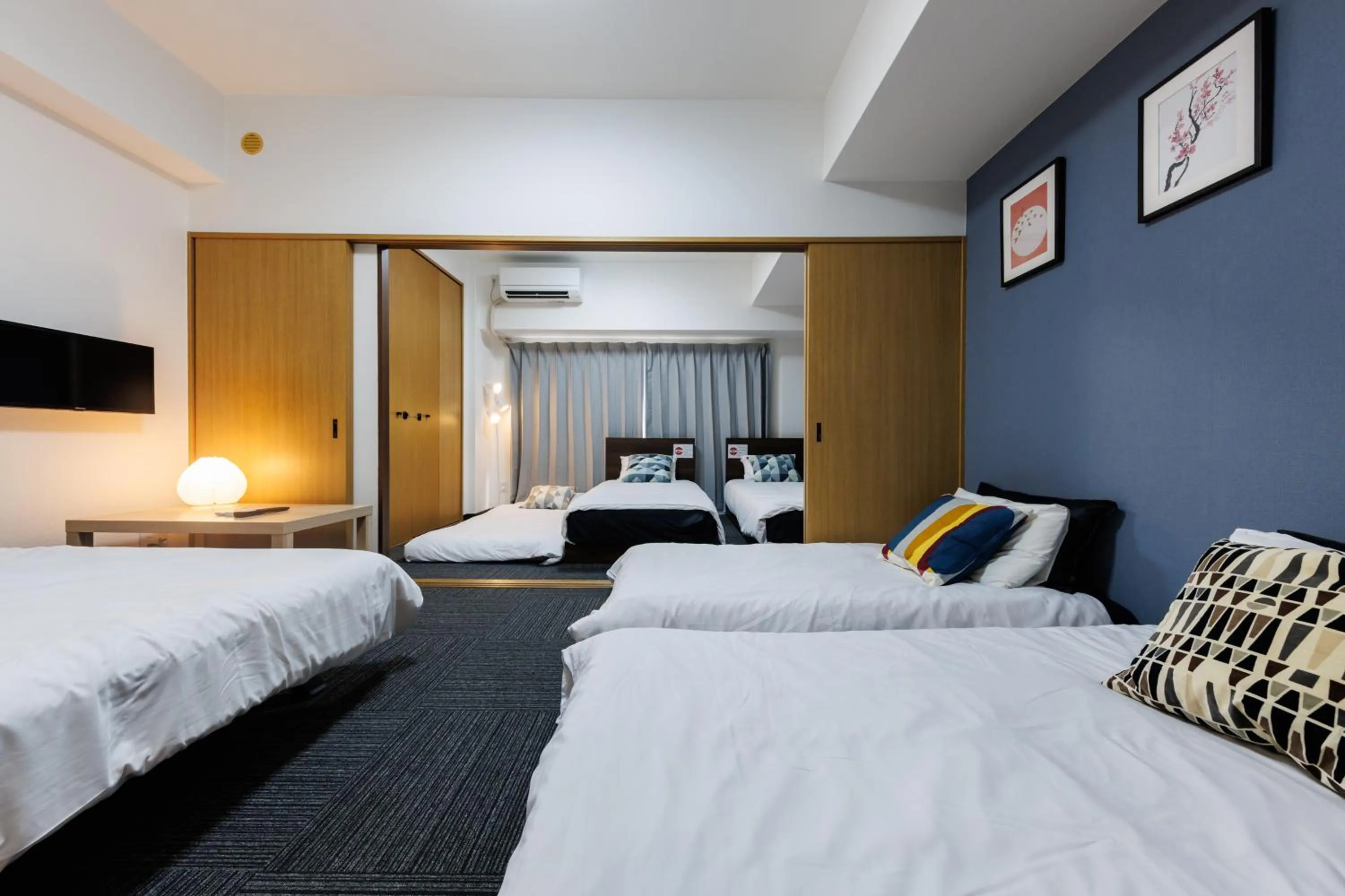 Bed in Grande Famille Shimanouchi Dotonbori Condo