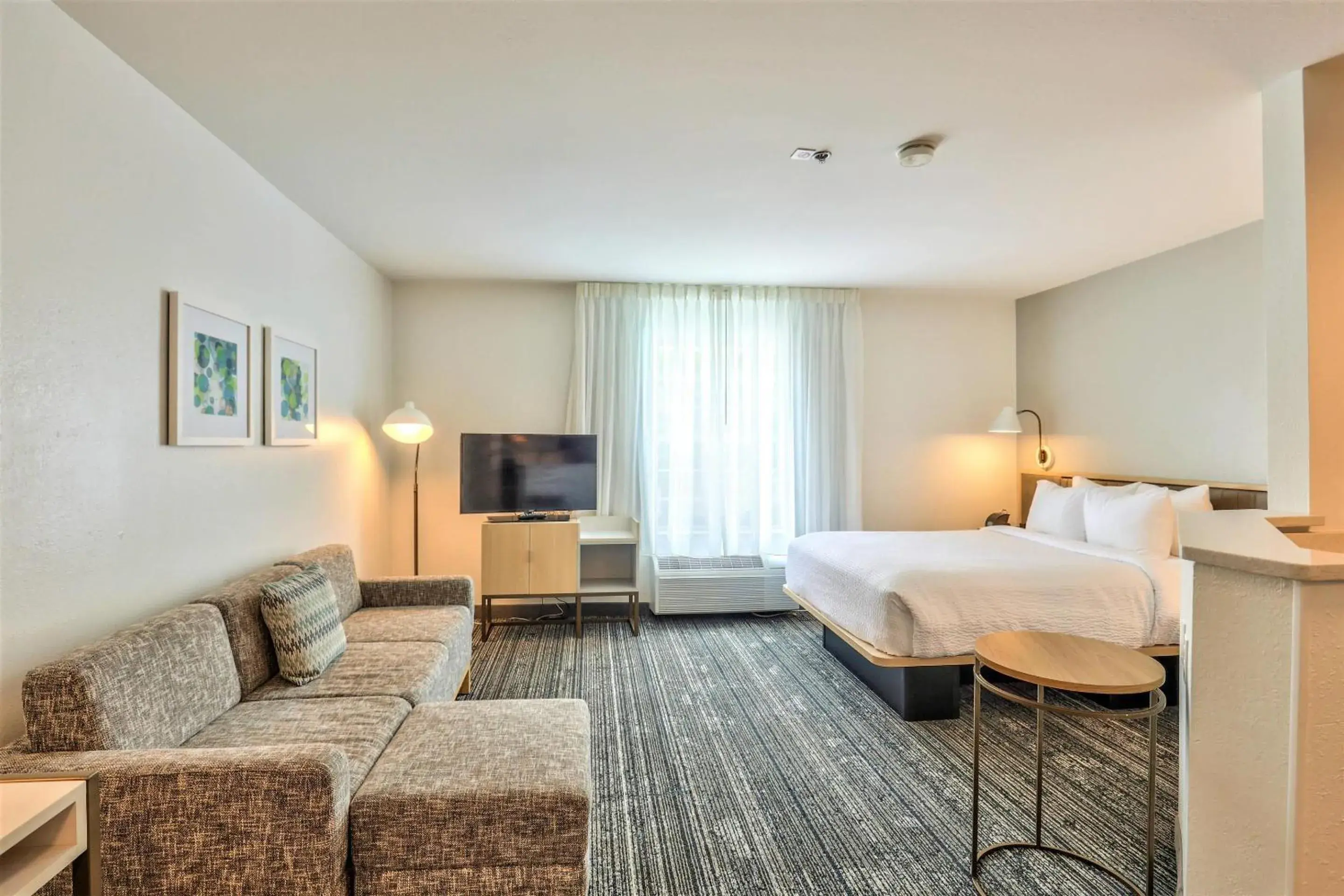 Bedroom in Alluxsuites at 1876, an Ascend Collection Hotel Bedroom in Alluxsuites at 1876, an Ascend Collection Hotel