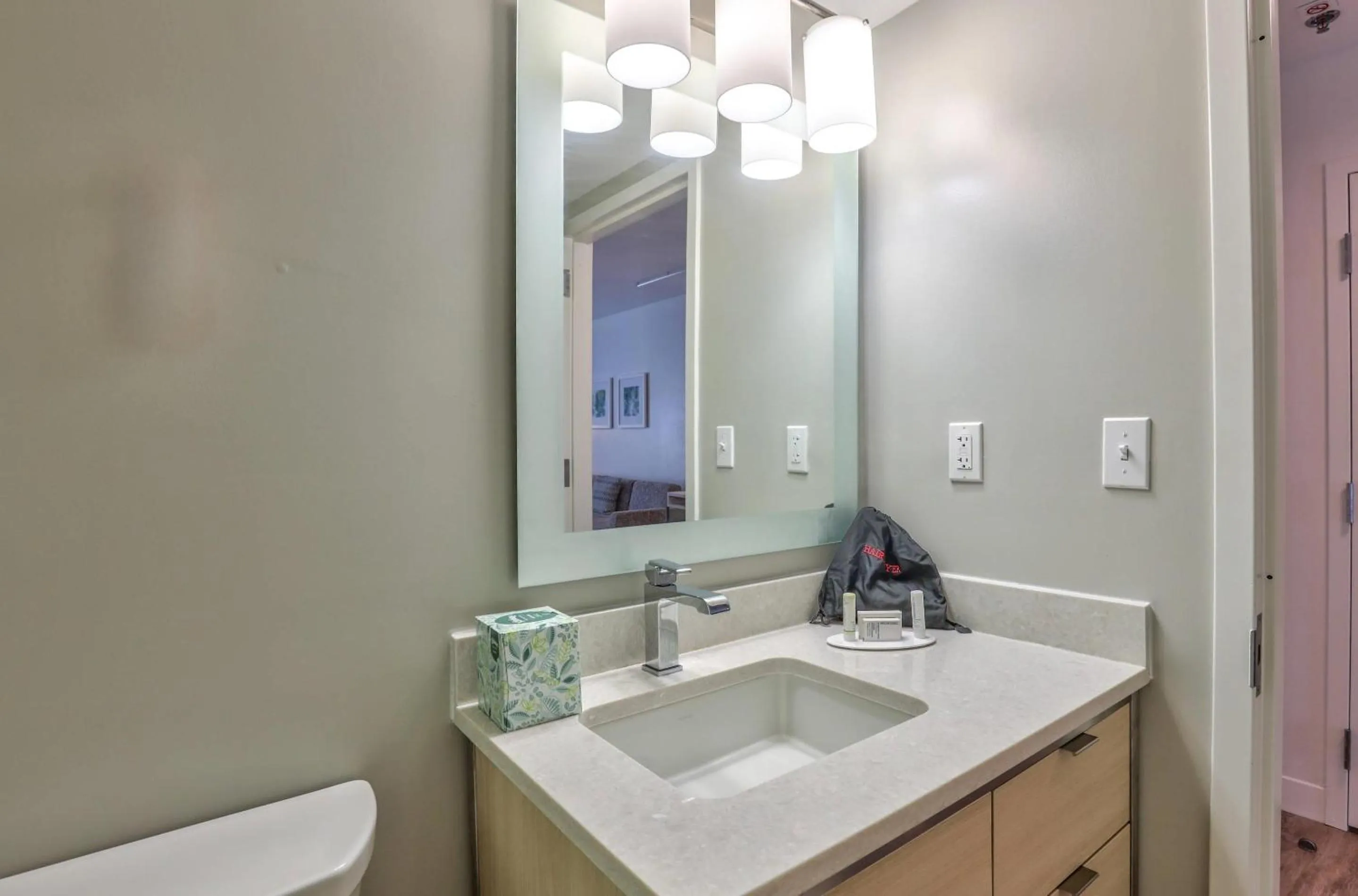 Bedroom in Alluxsuites at 1876, an Ascend Collection Hotel