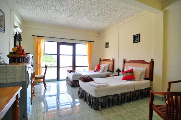 Bed in Baan Karon Hill Phuket Resort