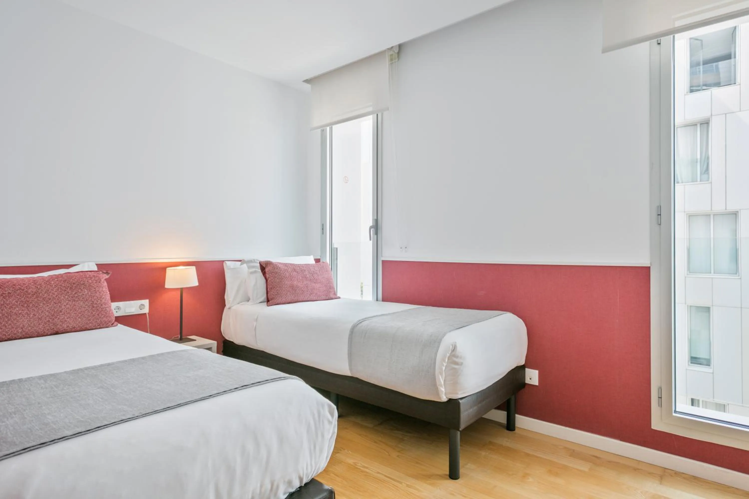 Bed in Lugaris Beach Apartments