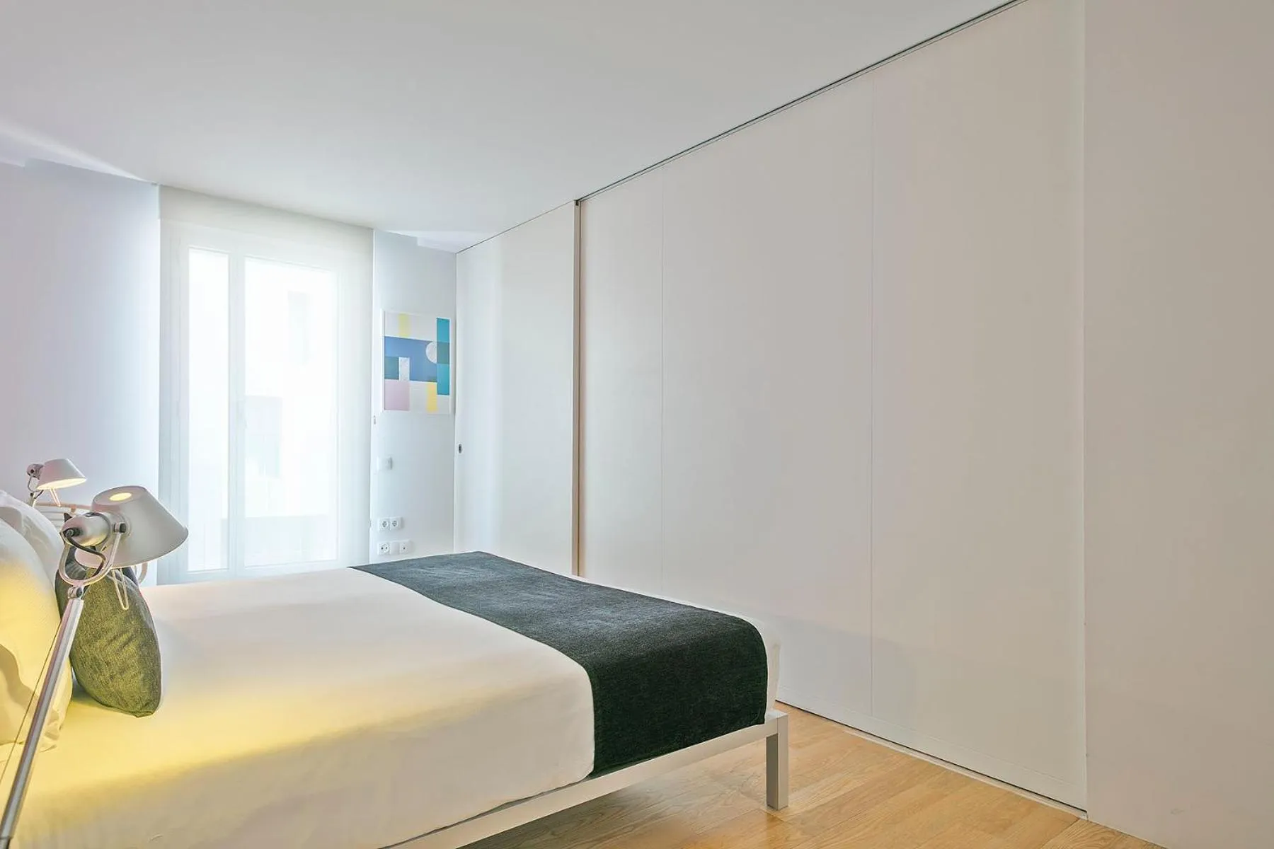 Bed in Lugaris Beach Apartments