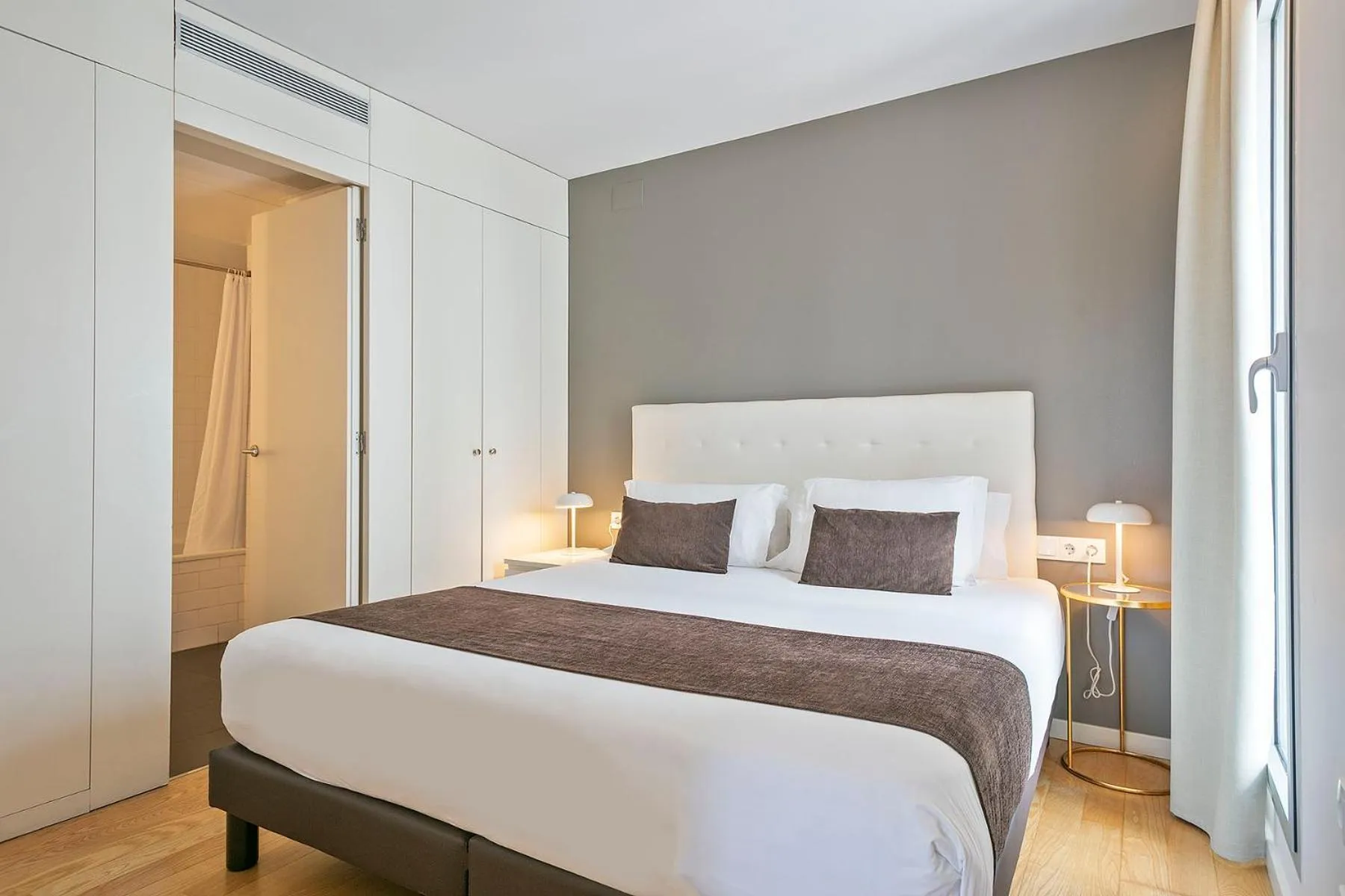 Bed in Lugaris Beach Apartments