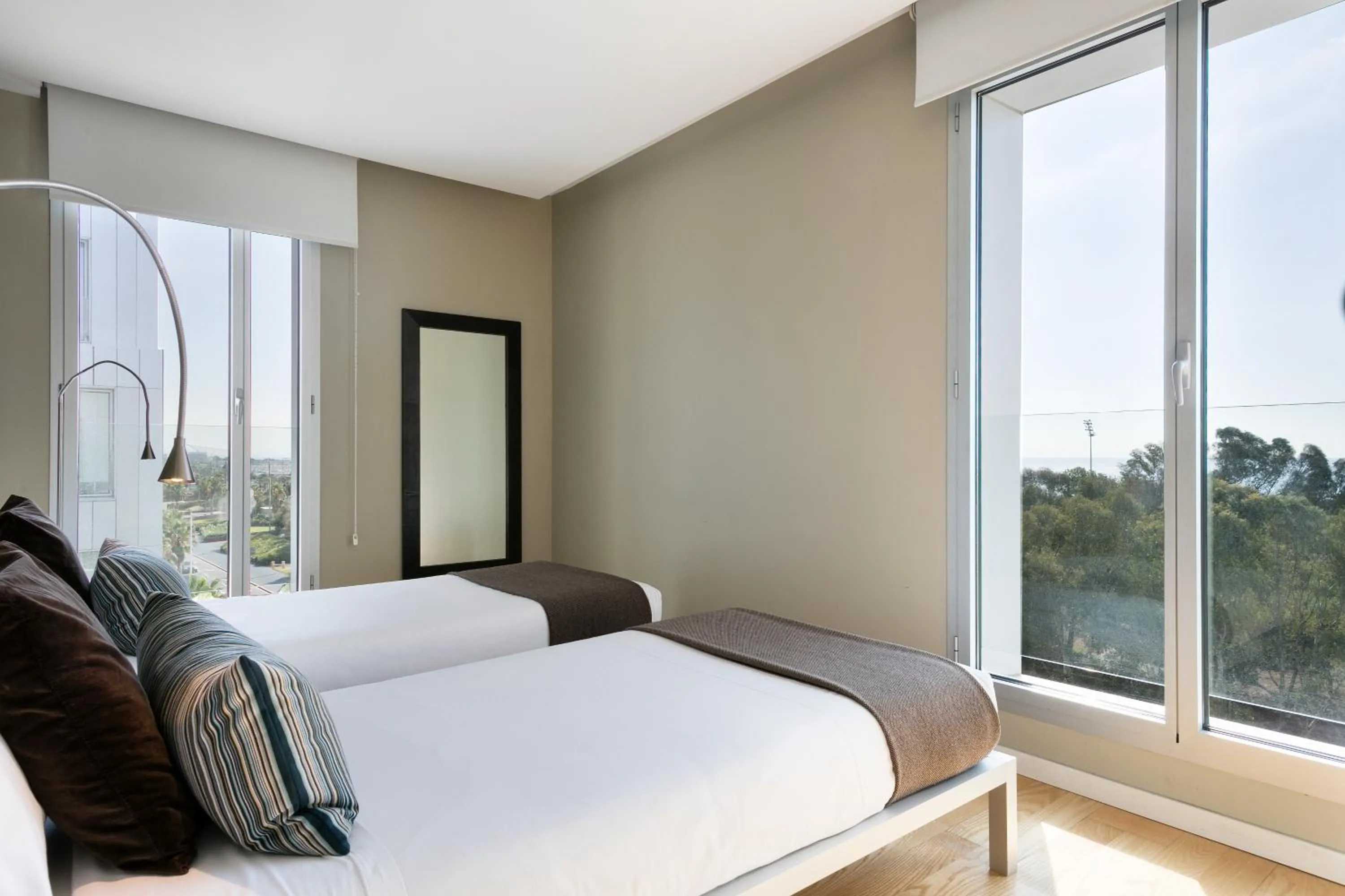 Bed in Lugaris Beach Apartments