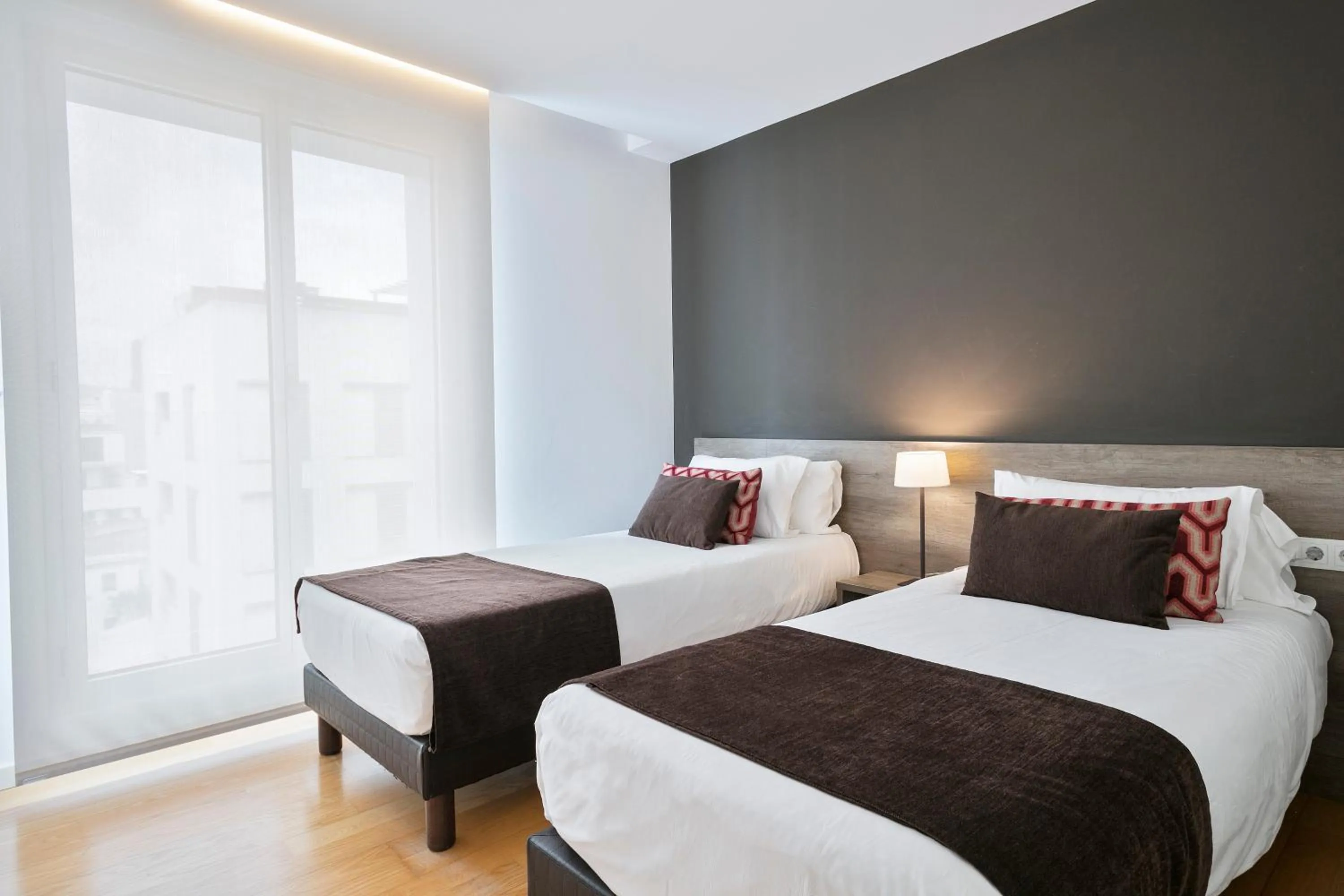 Bed in Lugaris Beach Apartments