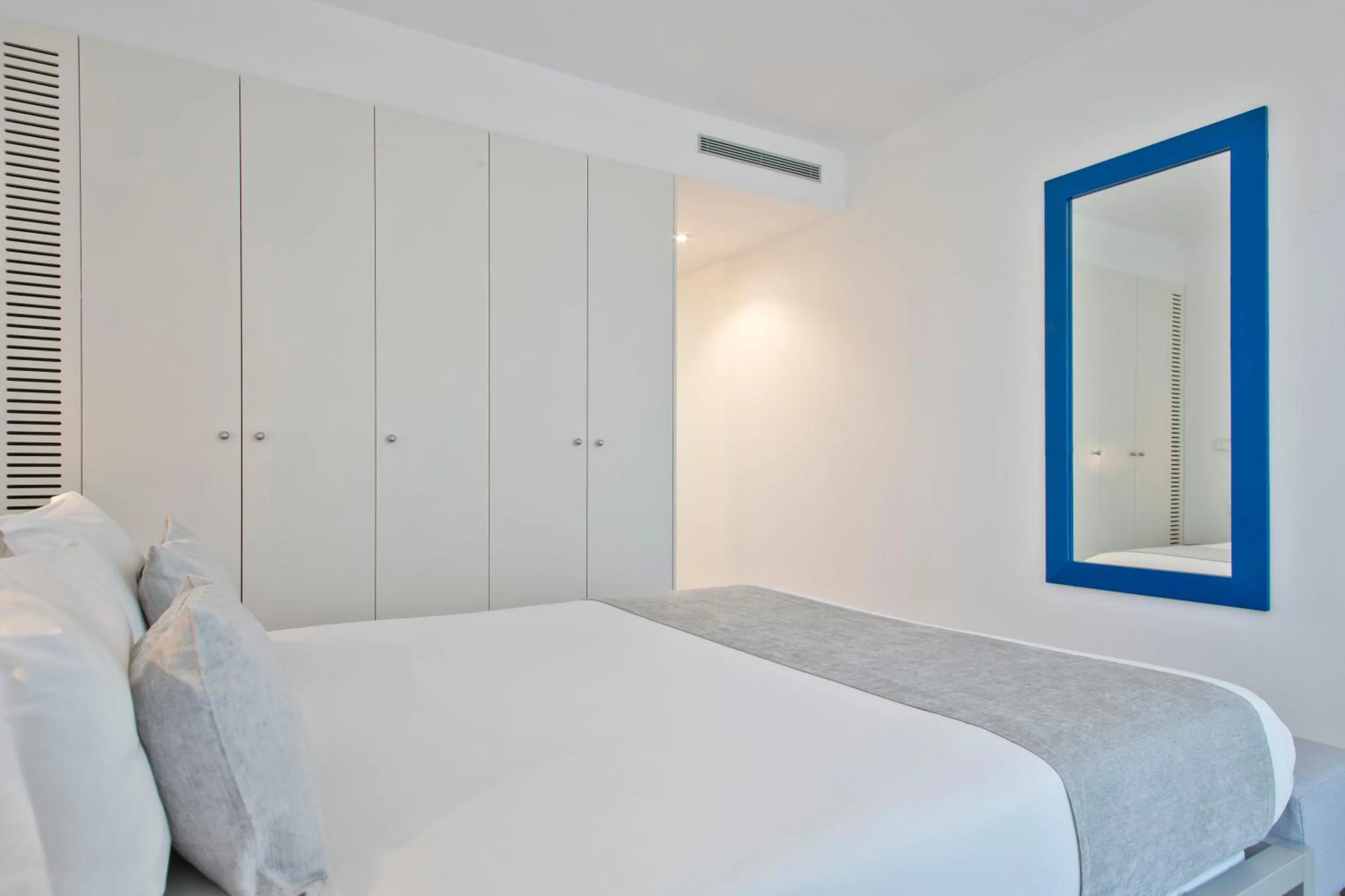 Bed in Lugaris Beach Apartments