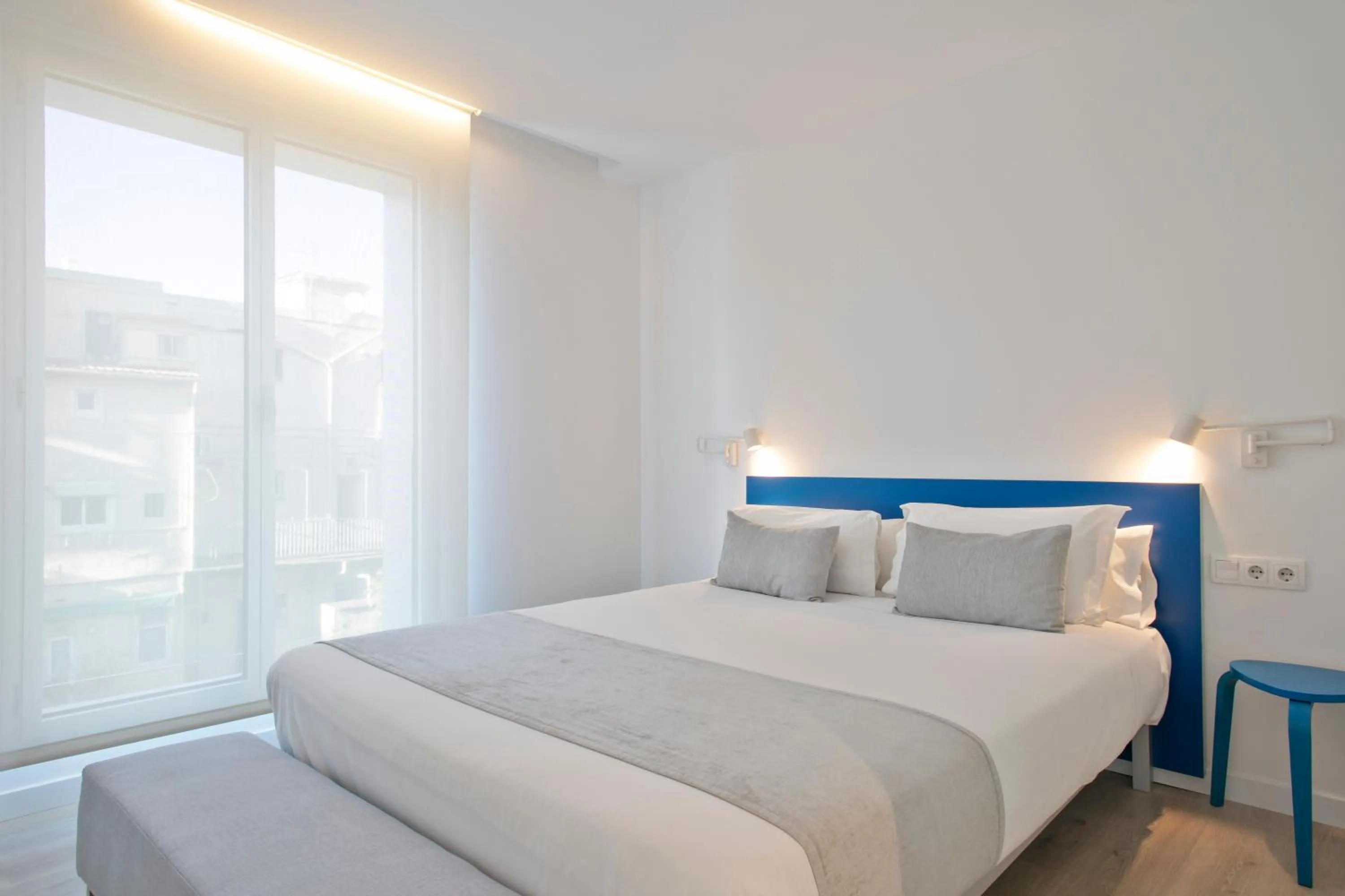 Bed in Lugaris Beach Apartments