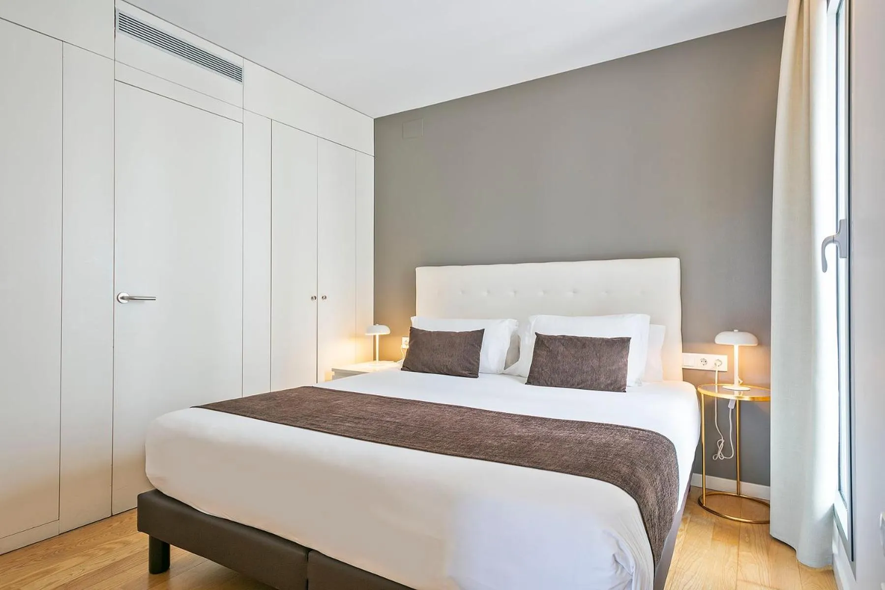 Bed in Lugaris Beach Apartments