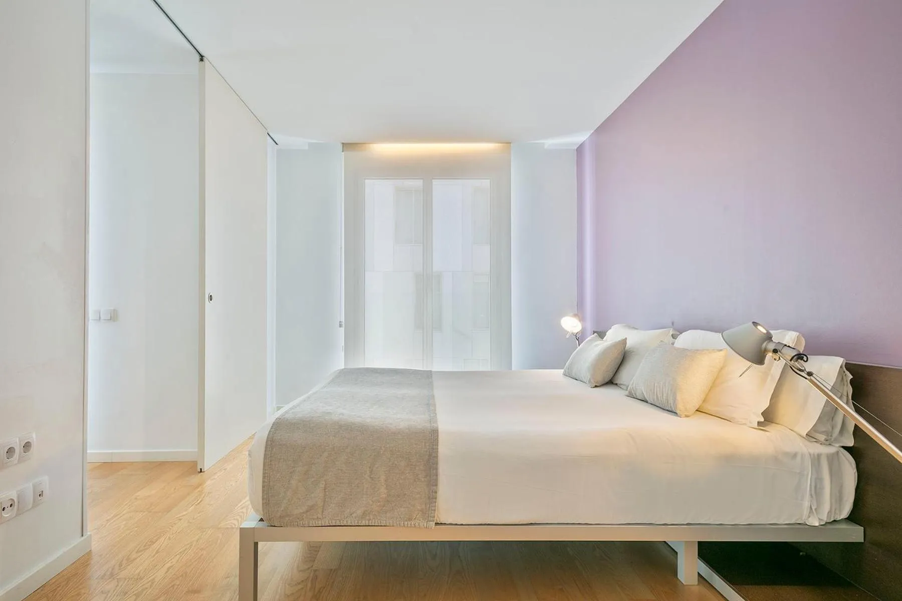 Bed in Lugaris Beach Apartments