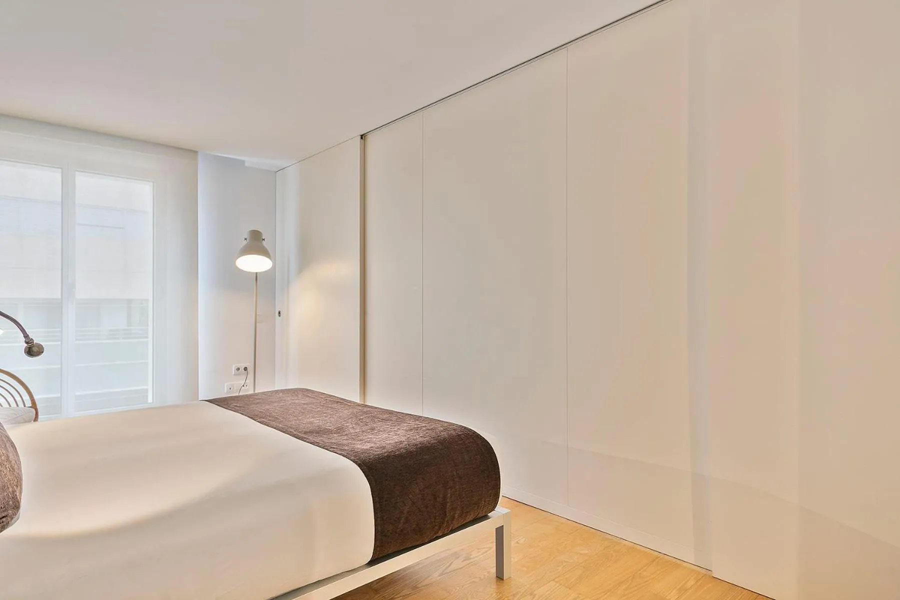 Bed in Lugaris Beach Apartments