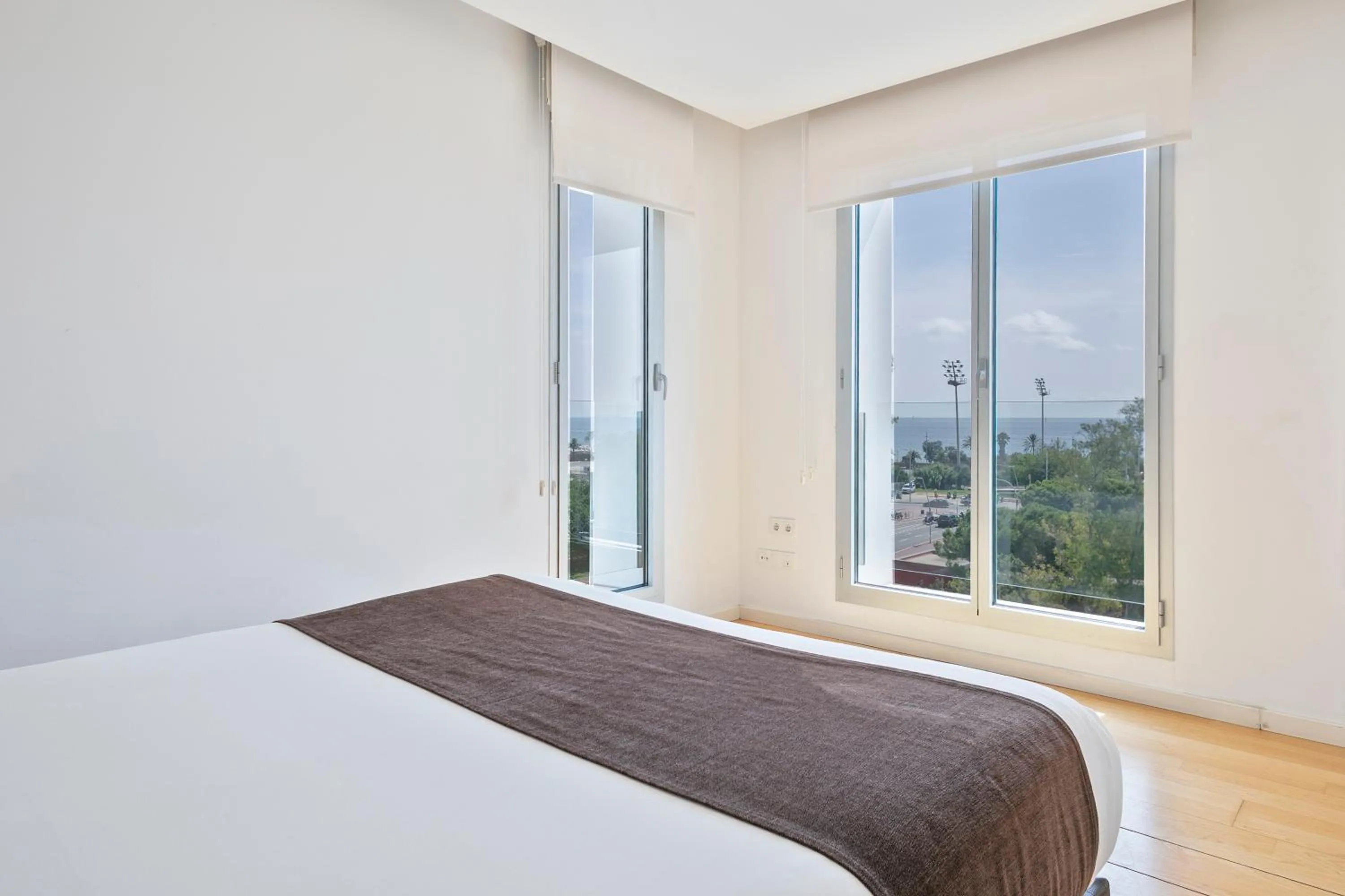 Bed in Lugaris Beach Apartments