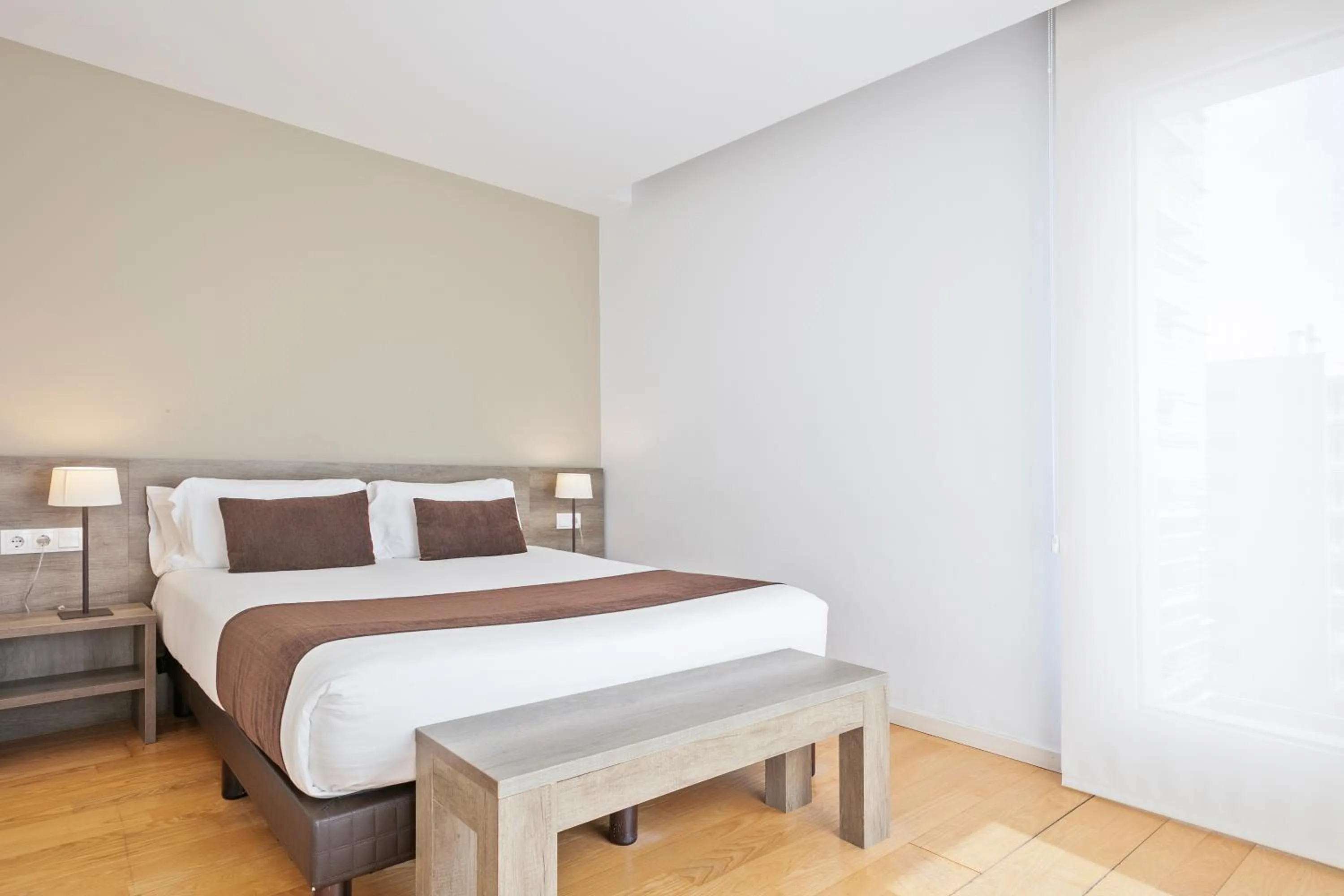 Bed in Lugaris Beach Apartments