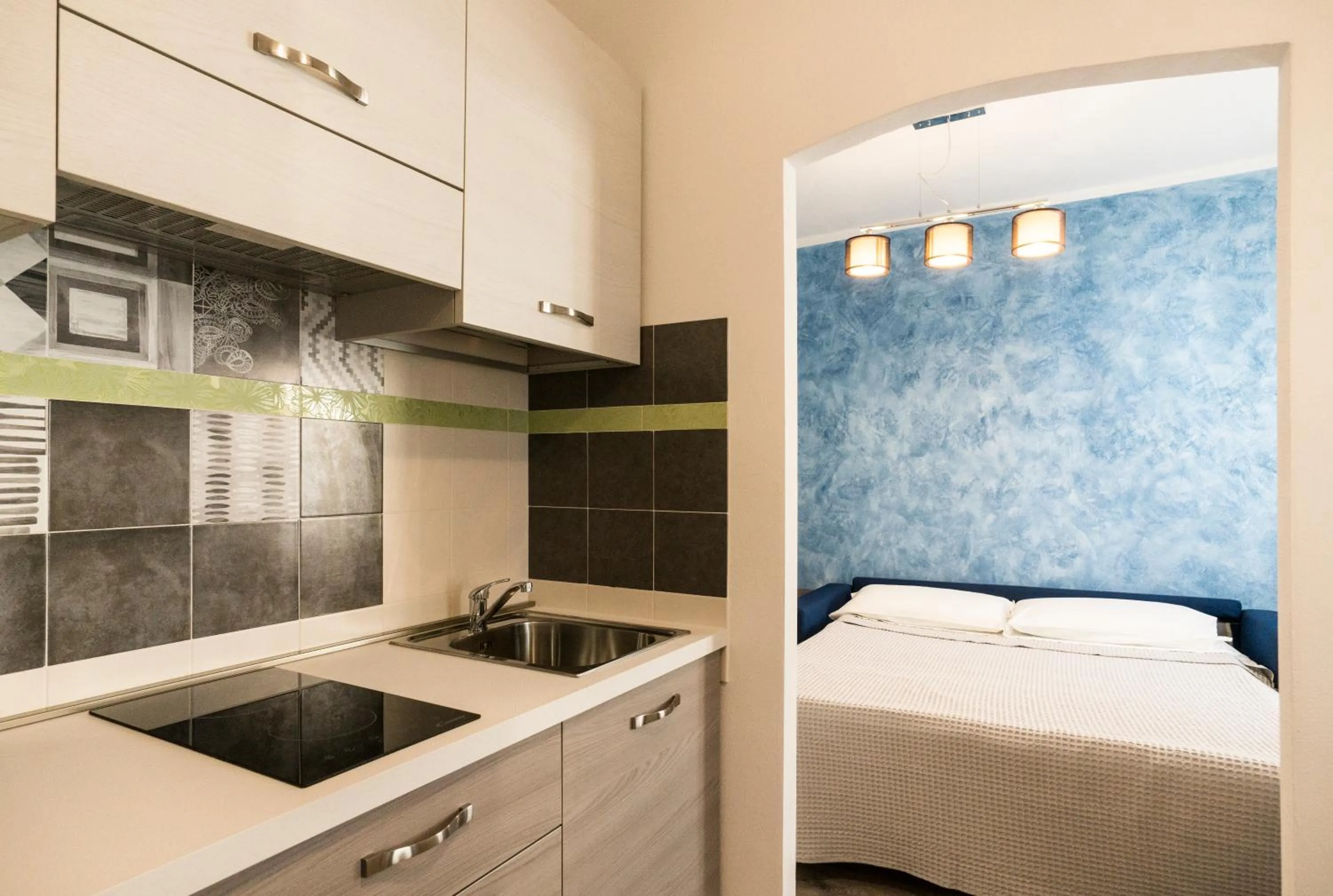 Kitchen or kitchenette, Bed in San Giorgio