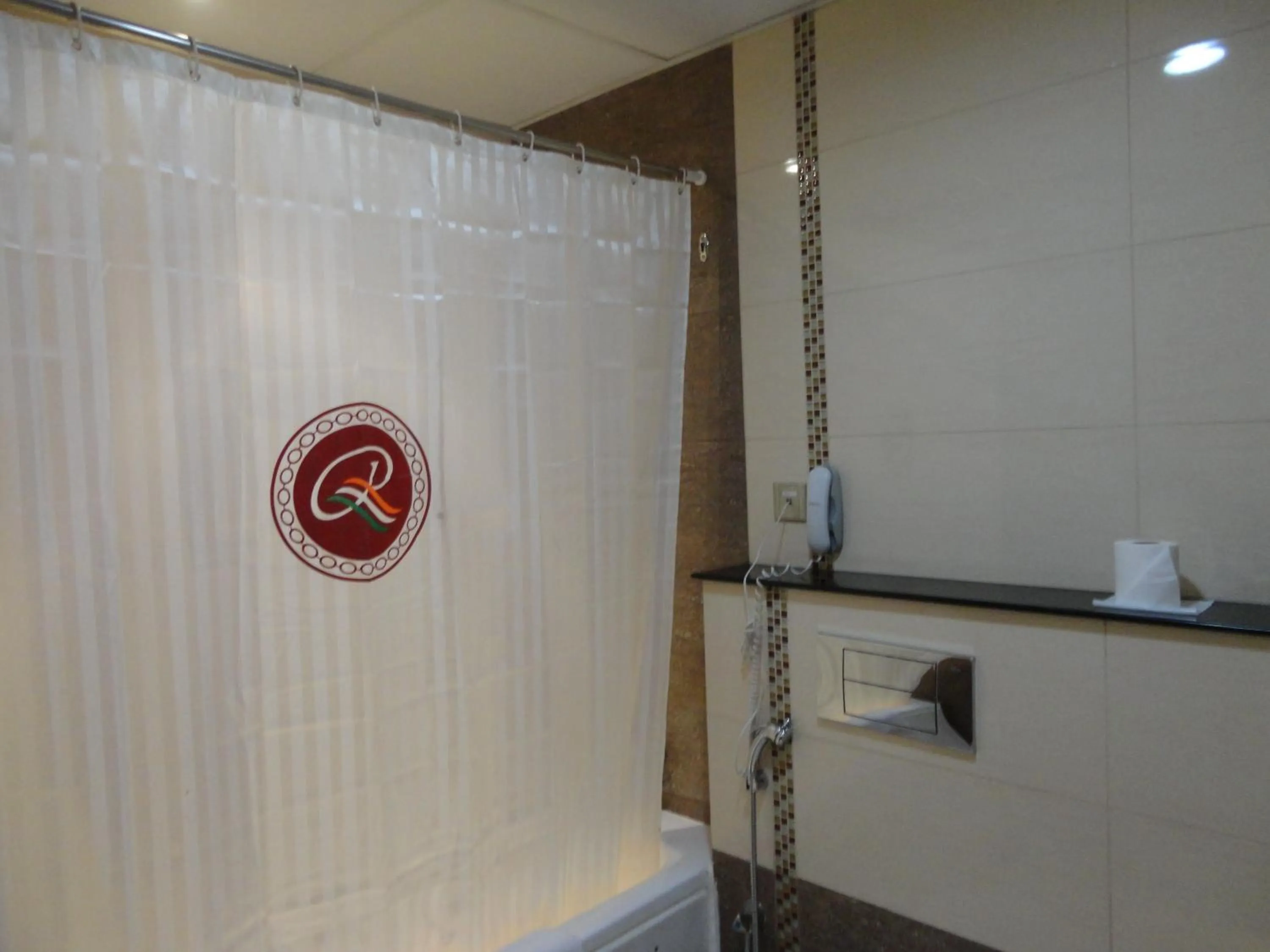 Bathroom in Ramee Rose Hotel