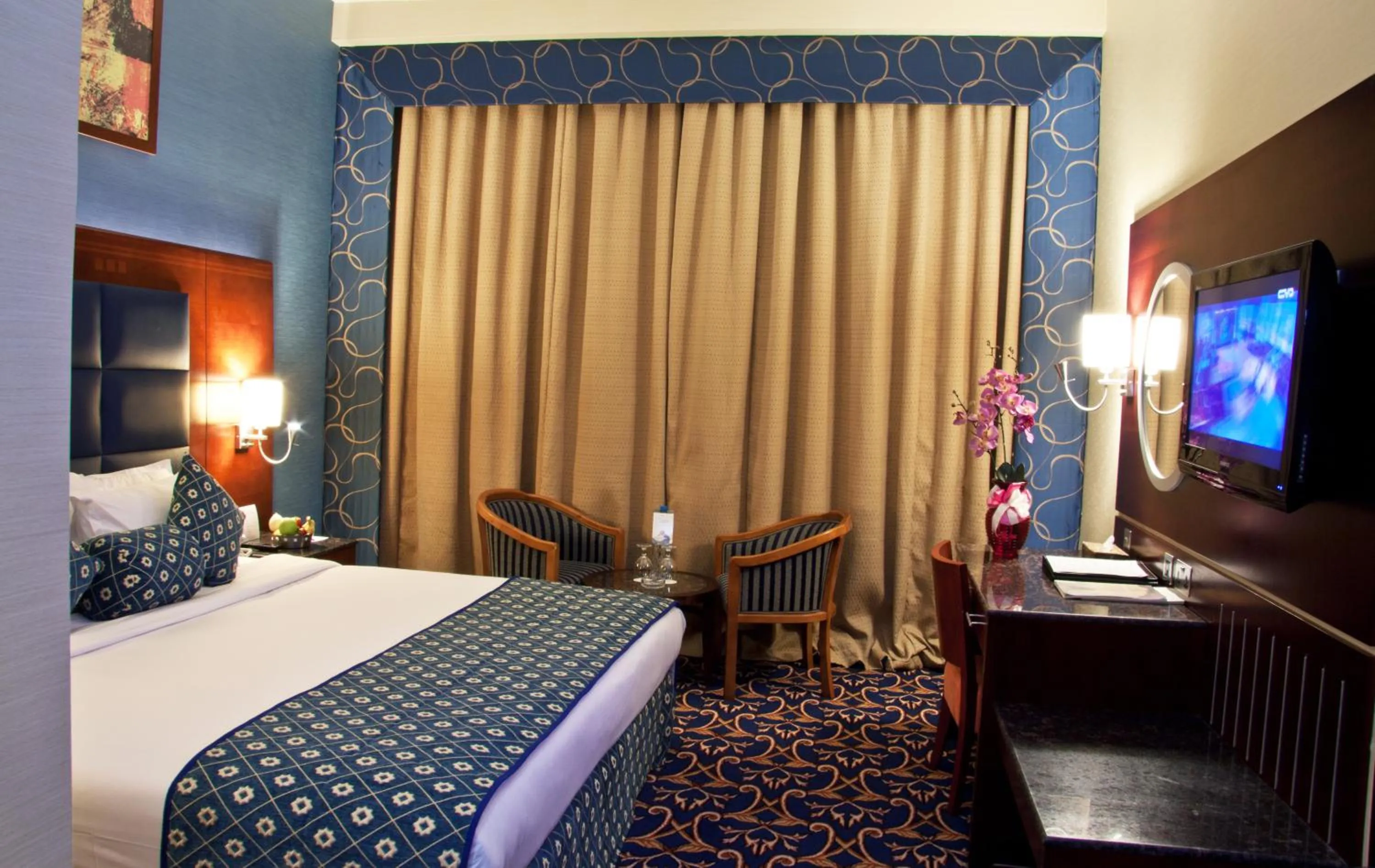 Bed in Ramee Rose Hotel