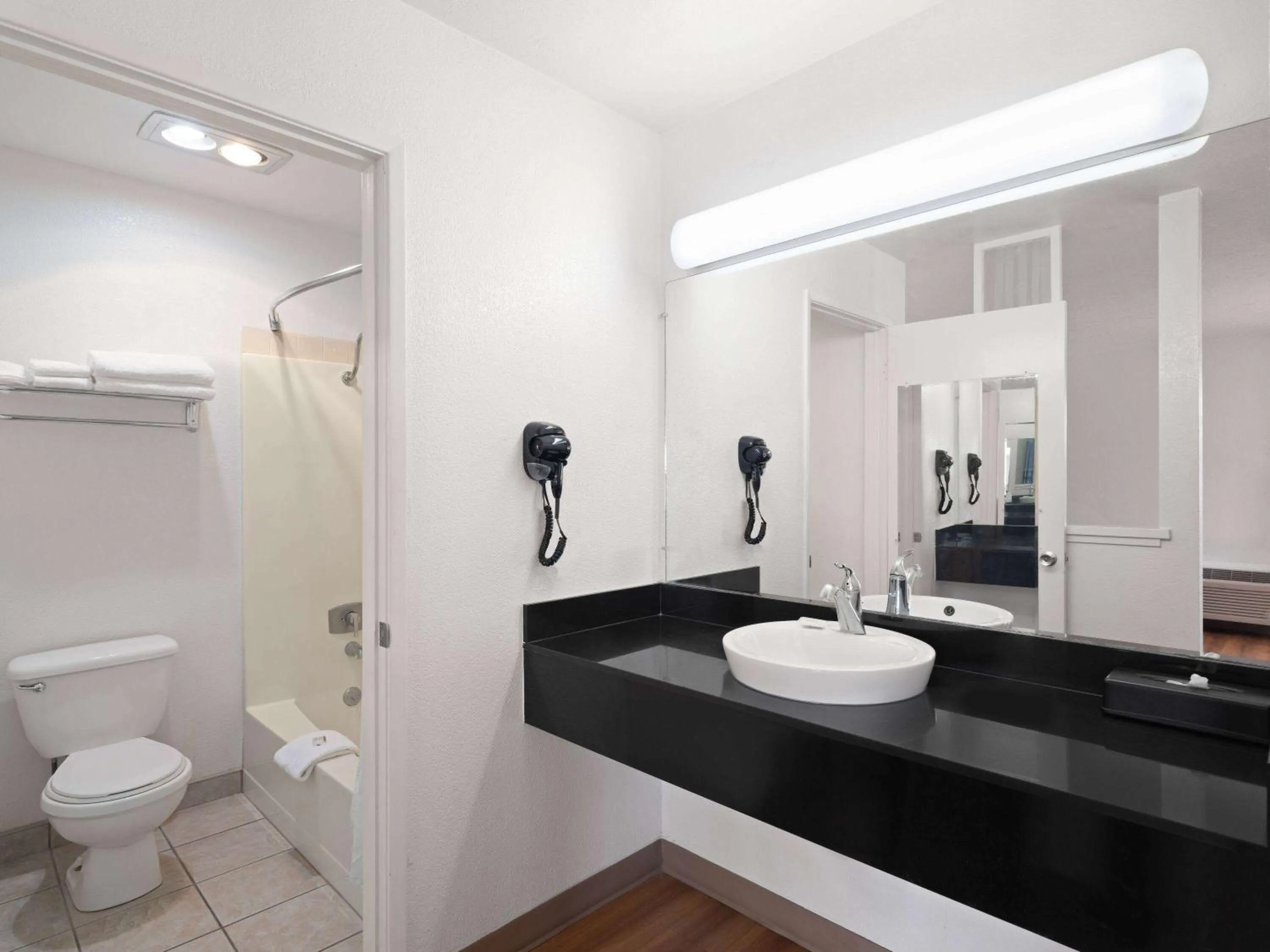 Bathroom in Super 8 by Wyndham Dunnigan