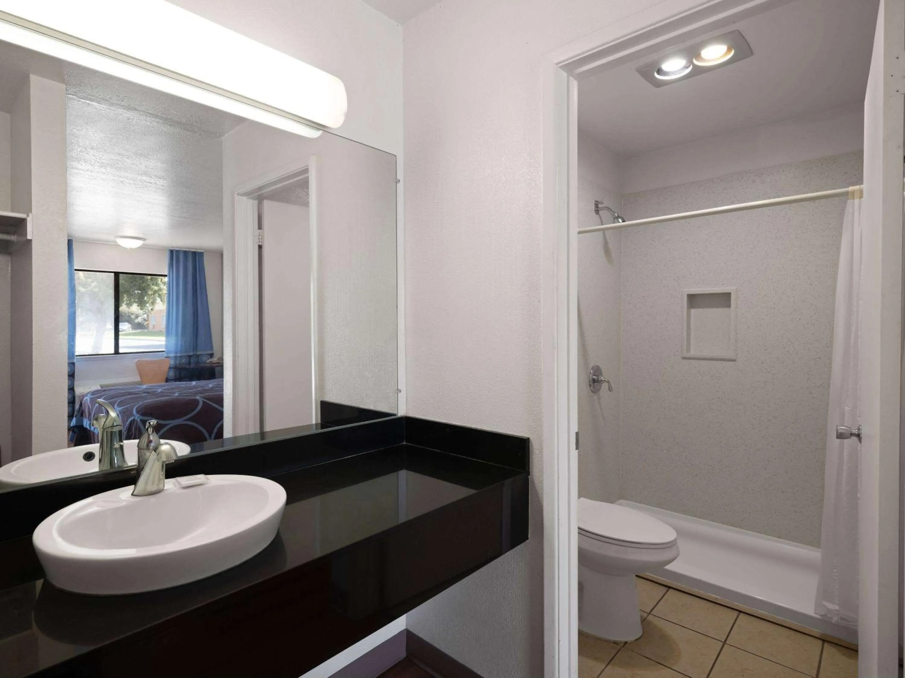 Bathroom in Super 8 by Wyndham Dunnigan