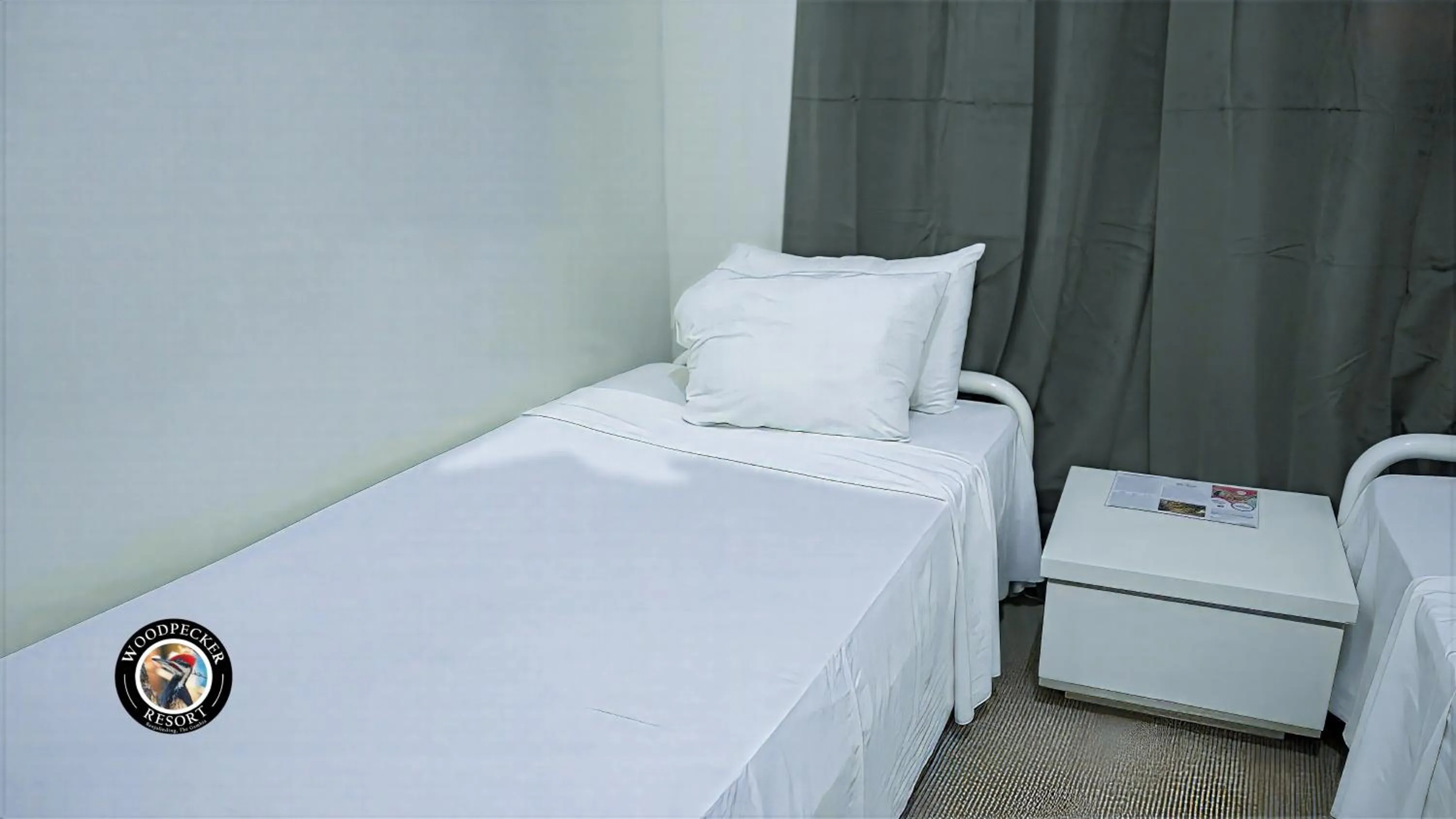 Bed in Woodpecker Resort Hotel